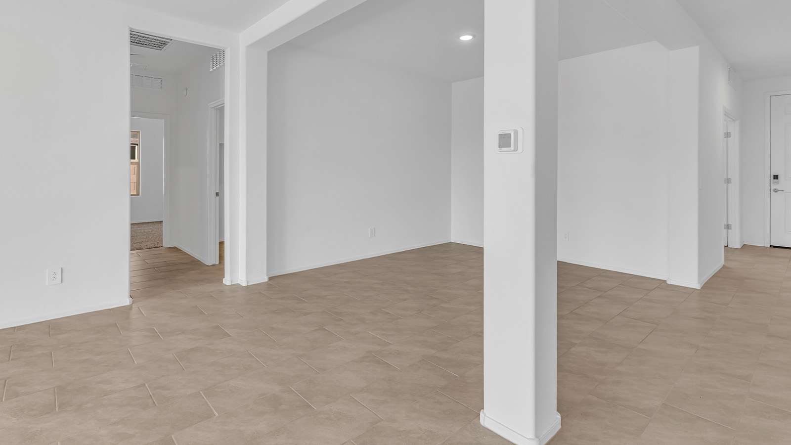 Welcome to The Pearl, a beautifully designed single-story new home located in the serene Cholla Ridge neighborhood of Saguaro Bloom. Spanning 2,431 square feet, this home offers four spacious bedrooms and three full bathrooms, making it an ideal choice for families who value both space and comfort.  As you enter through the front porch, you’re welcomed into a bright and open entryway that leads to the heart of the home. The expansive great room, dining area, and kitchen are seamlessly connected, providing a perfect setting for both everyday living and entertaining. The kitchen is a chef’s delight, featuring a large island, granite countertops, and Shaker-style cabinetry in double espresso. With a generously sized pantry and modern stainless steel gas appliances, this kitchen is both functional and stylish.  The Pearl’s layout includes a well-placed primary bedroom at the rear of the home, ensuring privacy and tranquility. The primary suite features a spacious walk-in closet and an en-suite bathroom with dual executive-height vanities and a large walk-in shower. The additional three bedrooms are located towards the front and sides of the home, each offering ample closet space and access to two full bathrooms, making this layout perfect for families and guests alike.  The outdoor living space is just as inviting, with a covered patio that extends from the great room, providing an ideal spot for enjoying Arizona’s beautiful weather. Whether you’re hosting a gathering or simply relaxing with a good book, this space is designed for your enjoyment.  The Pearl also features a dedicated utility room near the kitchen, making household tasks more convenient. A two-car garage offers plenty of space for vehicles and additional storage.  Built with energy efficiency and modern living in mind, The Pearl incorporates eco-friendly features and smart home technology, ensuring a comfortable and sustainable lifestyle. Large windows throughout the home allow natural light to flood the space, creating a warm and inviting atmosphere.  Located within the exclusive Cholla Ridge neighborhood at Saguaro Bloom, residents of The Pearl enjoy a range of amenities, including beautiful 12x24” tile flooring, and gourmet kitchens in select homes, all on lots with no rear neighbors. The community offers access to two pools, walking trails, and parks, all set against the stunning backdrop of the Tucson Mountains.  The Pearl combines style, comfort, and practicality, making it a perfect place to call home in one of Marana’s most sought-after communities.