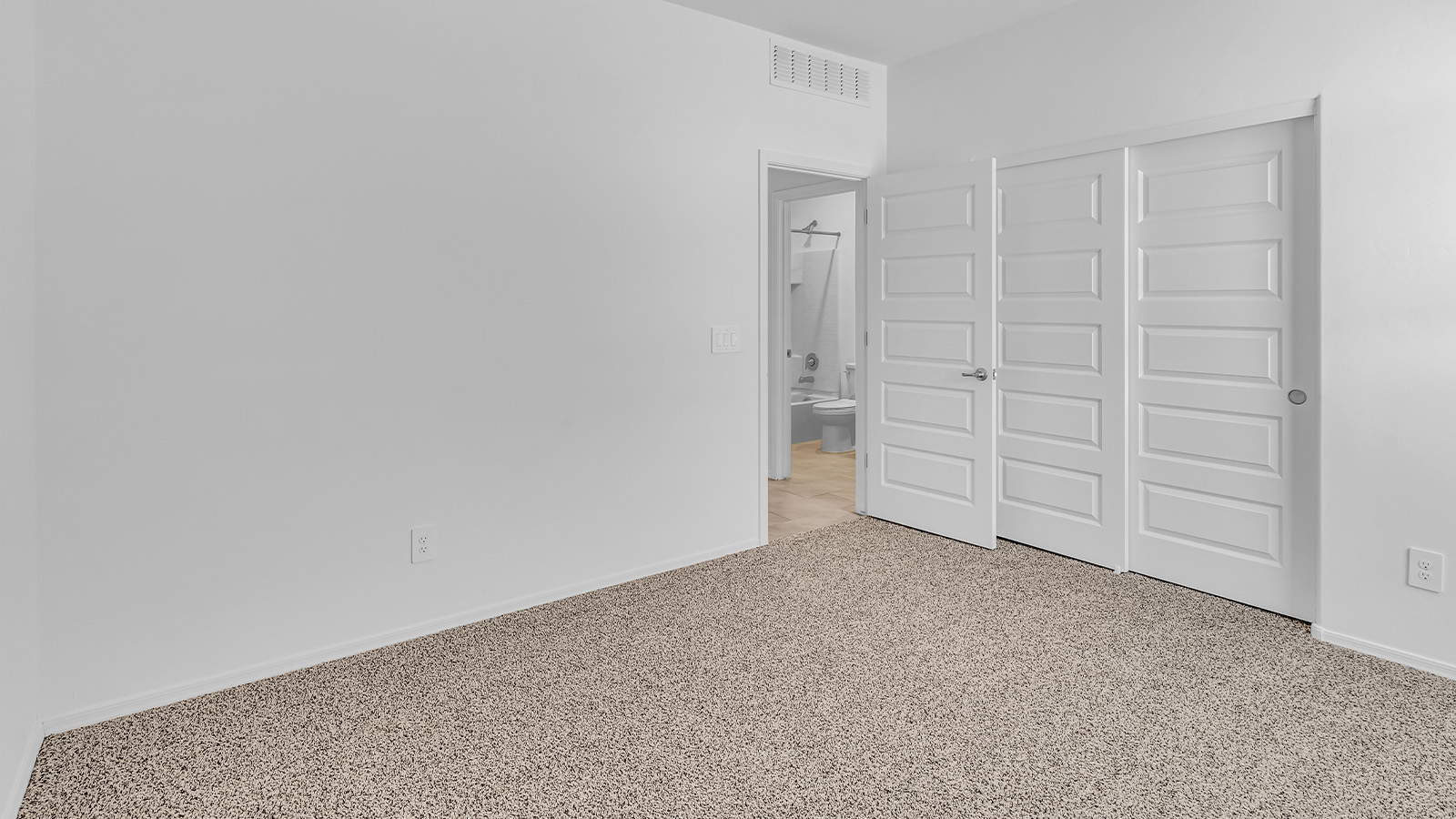 Welcome to The Pearl, a beautifully designed single-story new home located in the serene Cholla Ridge neighborhood of Saguaro Bloom. Spanning 2,431 square feet, this home offers four spacious bedrooms and three full bathrooms, making it an ideal choice for families who value both space and comfort.  As you enter through the front porch, you’re welcomed into a bright and open entryway that leads to the heart of the home. The expansive great room, dining area, and kitchen are seamlessly connected, providing a perfect setting for both everyday living and entertaining. The kitchen is a chef’s delight, featuring a large island, granite countertops, and Shaker-style cabinetry in double espresso. With a generously sized pantry and modern stainless steel gas appliances, this kitchen is both functional and stylish.  The Pearl’s layout includes a well-placed primary bedroom at the rear of the home, ensuring privacy and tranquility. The primary suite features a spacious walk-in closet and an en-suite bathroom with dual executive-height vanities and a large walk-in shower. The additional three bedrooms are located towards the front and sides of the home, each offering ample closet space and access to two full bathrooms, making this layout perfect for families and guests alike.  The outdoor living space is just as inviting, with a covered patio that extends from the great room, providing an ideal spot for enjoying Arizona’s beautiful weather. Whether you’re hosting a gathering or simply relaxing with a good book, this space is designed for your enjoyment.  The Pearl also features a dedicated utility room near the kitchen, making household tasks more convenient. A two-car garage offers plenty of space for vehicles and additional storage.  Built with energy efficiency and modern living in mind, The Pearl incorporates eco-friendly features and smart home technology, ensuring a comfortable and sustainable lifestyle. Large windows throughout the home allow natural light to flood the space, creating a warm and inviting atmosphere.  Located within the exclusive Cholla Ridge neighborhood at Saguaro Bloom, residents of The Pearl enjoy a range of amenities, including beautiful 12x24” tile flooring, and gourmet kitchens in select homes, all on lots with no rear neighbors. The community offers access to two pools, walking trails, and parks, all set against the stunning backdrop of the Tucson Mountains.  The Pearl combines style, comfort, and practicality, making it a perfect place to call home in one of Marana’s most sought-after communities.