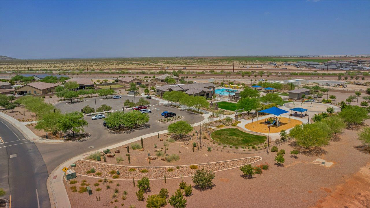 Welcome to The Citrine, a spacious single-story new home located in the tranquil Cholla Ridge neighborhood of Saguaro Bloom. With 2,577 square feet of well-planned living space, this home offers four bedrooms, three bathrooms, and a dedicated study, making it ideal for families who value both space and convenience.  As you enter through the inviting covered porch, you’re greeted by a bright and airy entryway that flows into the heart of the home. The expansive great room, dining area, and kitchen are thoughtfully connected, creating an ideal space for entertaining or simply enjoying time with family. The kitchen is a chef's dream, featuring a large island, granite countertops, and Shaker-style cabinetry in double espresso. A spacious pantry and modern stainless steel gas appliances ensure that this kitchen is both functional and stylish.  The Citrine’s layout includes a generously sized primary bedroom, carefully positioned for privacy at the rear of the home. This room features a large walk-in closet and an en-suite bathroom with dual executive-height vanities and a luxurious super shower. The additional three bedrooms are well-sized and located in separate areas of the home, ensuring privacy and easy access to two more full bathrooms.  One of the highlights of The Citrine is its versatile study, which can be used as a home office, library, media room, or extra bedroom depending on your needs. The large laundry room, conveniently situated near the bedrooms, adds to the home’s practicality.  The covered patio, accessible from the great room, offers a perfect spot for outdoor living, where you can enjoy Arizona’s beautiful weather throughout the year. Whether you’re hosting a barbecue or simply relaxing, this outdoor space enhances the home’s appeal.  Designed with energy efficiency and modern living in mind, The Citrine includes eco-friendly features and smart home technology, ensuring comfort and sustainability. Large windows throughout the home allow natural light to brighten every corner, creating a warm and welcoming atmosphere.  Located within the exclusive Cholla Ridge neighborhood at Saguaro Bloom, residents of The Citrine enjoy a range of premium features, including beautiful 12x24” tile flooring, gourmet kitchens, and 10’ ceilings in select homes. The community offers access to two pools, walking trails, parks, and more, all set against the picturesque backdrop of the Tucson Mountains.  The Citrine combines style, comfort, and practicality, making it a perfect place to call home in one of Marana’s most sought-after communities.