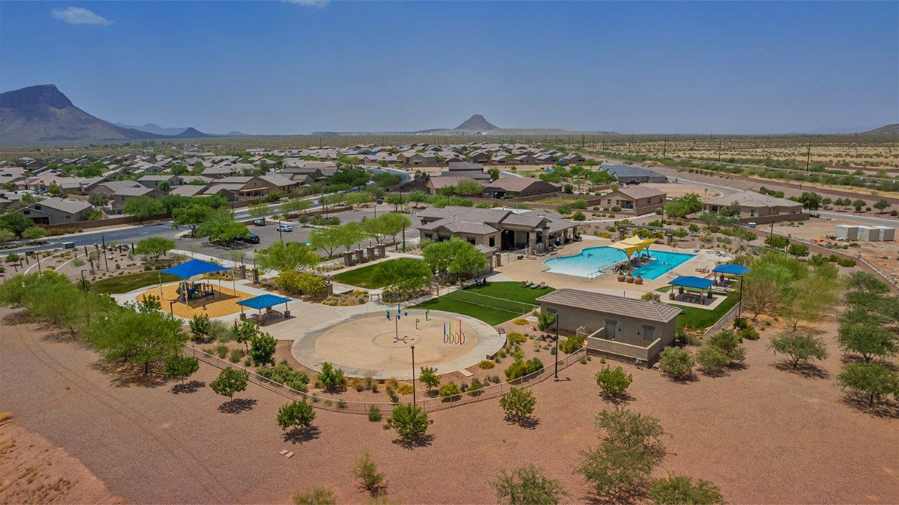 Welcome to The Citrine, a spacious single-story new home located in the tranquil Cholla Ridge neighborhood of Saguaro Bloom. With 2,577 square feet of well-planned living space, this home offers four bedrooms, three bathrooms, and a dedicated study, making it ideal for families who value both space and convenience.  As you enter through the inviting covered porch, you’re greeted by a bright and airy entryway that flows into the heart of the home. The expansive great room, dining area, and kitchen are thoughtfully connected, creating an ideal space for entertaining or simply enjoying time with family. The kitchen is a chef's dream, featuring a large island, granite countertops, and Shaker-style cabinetry in double espresso. A spacious pantry and modern stainless steel gas appliances ensure that this kitchen is both functional and stylish.  The Citrine’s layout includes a generously sized primary bedroom, carefully positioned for privacy at the rear of the home. This room features a large walk-in closet and an en-suite bathroom with dual executive-height vanities and a luxurious super shower. The additional three bedrooms are well-sized and located in separate areas of the home, ensuring privacy and easy access to two more full bathrooms.  One of the highlights of The Citrine is its versatile study, which can be used as a home office, library, media room, or extra bedroom depending on your needs. The large laundry room, conveniently situated near the bedrooms, adds to the home’s practicality.  The covered patio, accessible from the great room, offers a perfect spot for outdoor living, where you can enjoy Arizona’s beautiful weather throughout the year. Whether you’re hosting a barbecue or simply relaxing, this outdoor space enhances the home’s appeal.  Designed with energy efficiency and modern living in mind, The Citrine includes eco-friendly features and smart home technology, ensuring comfort and sustainability. Large windows throughout the home allow natural light to brighten every corner, creating a warm and welcoming atmosphere.  Located within the exclusive Cholla Ridge neighborhood at Saguaro Bloom, residents of The Citrine enjoy a range of premium features, including beautiful 12x24” tile flooring, gourmet kitchens, and 10’ ceilings in select homes. The community offers access to two pools, walking trails, parks, and more, all set against the picturesque backdrop of the Tucson Mountains.  The Citrine combines style, comfort, and practicality, making it a perfect place to call home in one of Marana’s most sought-after communities.