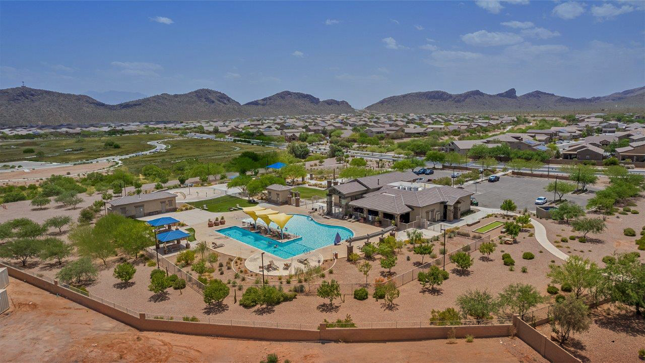 Welcome to The Citrine, a spacious single-story new home located in the tranquil Cholla Ridge neighborhood of Saguaro Bloom. With 2,577 square feet of well-planned living space, this home offers four bedrooms, three bathrooms, and a dedicated study, making it ideal for families who value both space and convenience.  As you enter through the inviting covered porch, you’re greeted by a bright and airy entryway that flows into the heart of the home. The expansive great room, dining area, and kitchen are thoughtfully connected, creating an ideal space for entertaining or simply enjoying time with family. The kitchen is a chef's dream, featuring a large island, granite countertops, and Shaker-style cabinetry in double espresso. A spacious pantry and modern stainless steel gas appliances ensure that this kitchen is both functional and stylish.  The Citrine’s layout includes a generously sized primary bedroom, carefully positioned for privacy at the rear of the home. This room features a large walk-in closet and an en-suite bathroom with dual executive-height vanities and a luxurious super shower. The additional three bedrooms are well-sized and located in separate areas of the home, ensuring privacy and easy access to two more full bathrooms.  One of the highlights of The Citrine is its versatile study, which can be used as a home office, library, media room, or extra bedroom depending on your needs. The large laundry room, conveniently situated near the bedrooms, adds to the home’s practicality.  The covered patio, accessible from the great room, offers a perfect spot for outdoor living, where you can enjoy Arizona’s beautiful weather throughout the year. Whether you’re hosting a barbecue or simply relaxing, this outdoor space enhances the home’s appeal.  Designed with energy efficiency and modern living in mind, The Citrine includes eco-friendly features and smart home technology, ensuring comfort and sustainability. Large windows throughout the home allow natural light to brighten every corner, creating a warm and welcoming atmosphere.  Located within the exclusive Cholla Ridge neighborhood at Saguaro Bloom, residents of The Citrine enjoy a range of premium features, including beautiful 12x24” tile flooring, gourmet kitchens, and 10’ ceilings in select homes. The community offers access to two pools, walking trails, parks, and more, all set against the picturesque backdrop of the Tucson Mountains.  The Citrine combines style, comfort, and practicality, making it a perfect place to call home in one of Marana’s most sought-after communities.