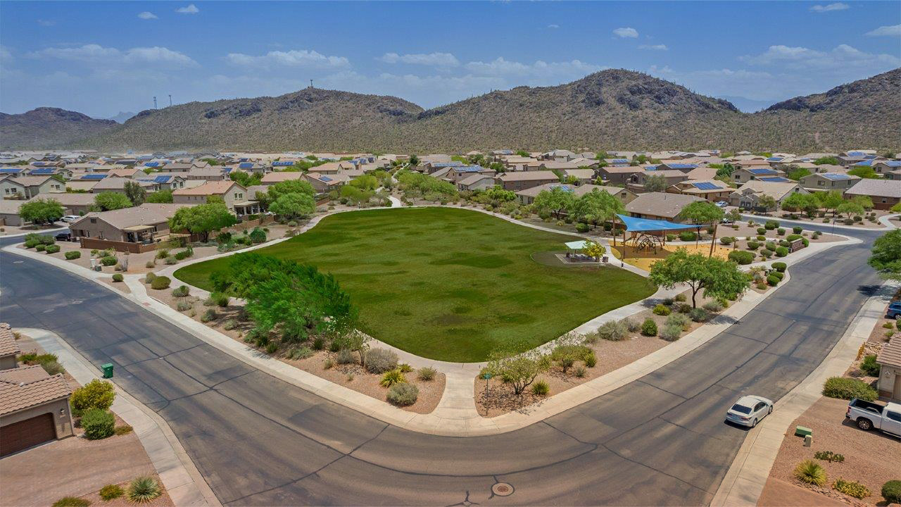 Welcome to The Citrine, a spacious single-story new home located in the tranquil Cholla Ridge neighborhood of Saguaro Bloom. With 2,577 square feet of well-planned living space, this home offers four bedrooms, three bathrooms, and a dedicated study, making it ideal for families who value both space and convenience.  As you enter through the inviting covered porch, you’re greeted by a bright and airy entryway that flows into the heart of the home. The expansive great room, dining area, and kitchen are thoughtfully connected, creating an ideal space for entertaining or simply enjoying time with family. The kitchen is a chef's dream, featuring a large island, granite countertops, and Shaker-style cabinetry in double espresso. A spacious pantry and modern stainless steel gas appliances ensure that this kitchen is both functional and stylish.  The Citrine’s layout includes a generously sized primary bedroom, carefully positioned for privacy at the rear of the home. This room features a large walk-in closet and an en-suite bathroom with dual executive-height vanities and a luxurious super shower. The additional three bedrooms are well-sized and located in separate areas of the home, ensuring privacy and easy access to two more full bathrooms.  One of the highlights of The Citrine is its versatile study, which can be used as a home office, library, media room, or extra bedroom depending on your needs. The large laundry room, conveniently situated near the bedrooms, adds to the home’s practicality.  The covered patio, accessible from the great room, offers a perfect spot for outdoor living, where you can enjoy Arizona’s beautiful weather throughout the year. Whether you’re hosting a barbecue or simply relaxing, this outdoor space enhances the home’s appeal.  Designed with energy efficiency and modern living in mind, The Citrine includes eco-friendly features and smart home technology, ensuring comfort and sustainability. Large windows throughout the home allow natural light to brighten every corner, creating a warm and welcoming atmosphere.  Located within the exclusive Cholla Ridge neighborhood at Saguaro Bloom, residents of The Citrine enjoy a range of premium features, including beautiful 12x24” tile flooring, gourmet kitchens, and 10’ ceilings in select homes. The community offers access to two pools, walking trails, parks, and more, all set against the picturesque backdrop of the Tucson Mountains.  The Citrine combines style, comfort, and practicality, making it a perfect place to call home in one of Marana’s most sought-after communities.