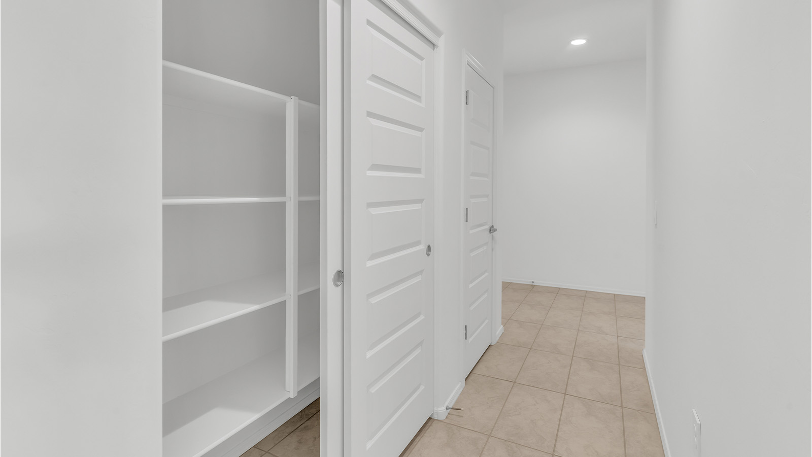 Welcome to The Citrine, a spacious single-story new home located in the tranquil Cholla Ridge neighborhood of Saguaro Bloom. With 2,577 square feet of well-planned living space, this home offers four bedrooms, three bathrooms, and a dedicated study, making it ideal for families who value both space and convenience.  As you enter through the inviting covered porch, you’re greeted by a bright and airy entryway that flows into the heart of the home. The expansive great room, dining area, and kitchen are thoughtfully connected, creating an ideal space for entertaining or simply enjoying time with family. The kitchen is a chef's dream, featuring a large island, granite countertops, and Shaker-style cabinetry in double espresso. A spacious pantry and modern stainless steel gas appliances ensure that this kitchen is both functional and stylish.  The Citrine’s layout includes a generously sized primary bedroom, carefully positioned for privacy at the rear of the home. This room features a large walk-in closet and an en-suite bathroom with dual executive-height vanities and a luxurious super shower. The additional three bedrooms are well-sized and located in separate areas of the home, ensuring privacy and easy access to two more full bathrooms.  One of the highlights of The Citrine is its versatile study, which can be used as a home office, library, media room, or extra bedroom depending on your needs. The large laundry room, conveniently situated near the bedrooms, adds to the home’s practicality.  The covered patio, accessible from the great room, offers a perfect spot for outdoor living, where you can enjoy Arizona’s beautiful weather throughout the year. Whether you’re hosting a barbecue or simply relaxing, this outdoor space enhances the home’s appeal.  Designed with energy efficiency and modern living in mind, The Citrine includes eco-friendly features and smart home technology, ensuring comfort and sustainability. Large windows throughout the home allow natural light to brighten every corner, creating a warm and welcoming atmosphere.  Located within the exclusive Cholla Ridge neighborhood at Saguaro Bloom, residents of The Citrine enjoy a range of premium features, including beautiful 12x24” tile flooring, gourmet kitchens, and 10’ ceilings in select homes. The community offers access to two pools, walking trails, parks, and more, all set against the picturesque backdrop of the Tucson Mountains.  The Citrine combines style, comfort, and practicality, making it a perfect place to call home in one of Marana’s most sought-after communities.