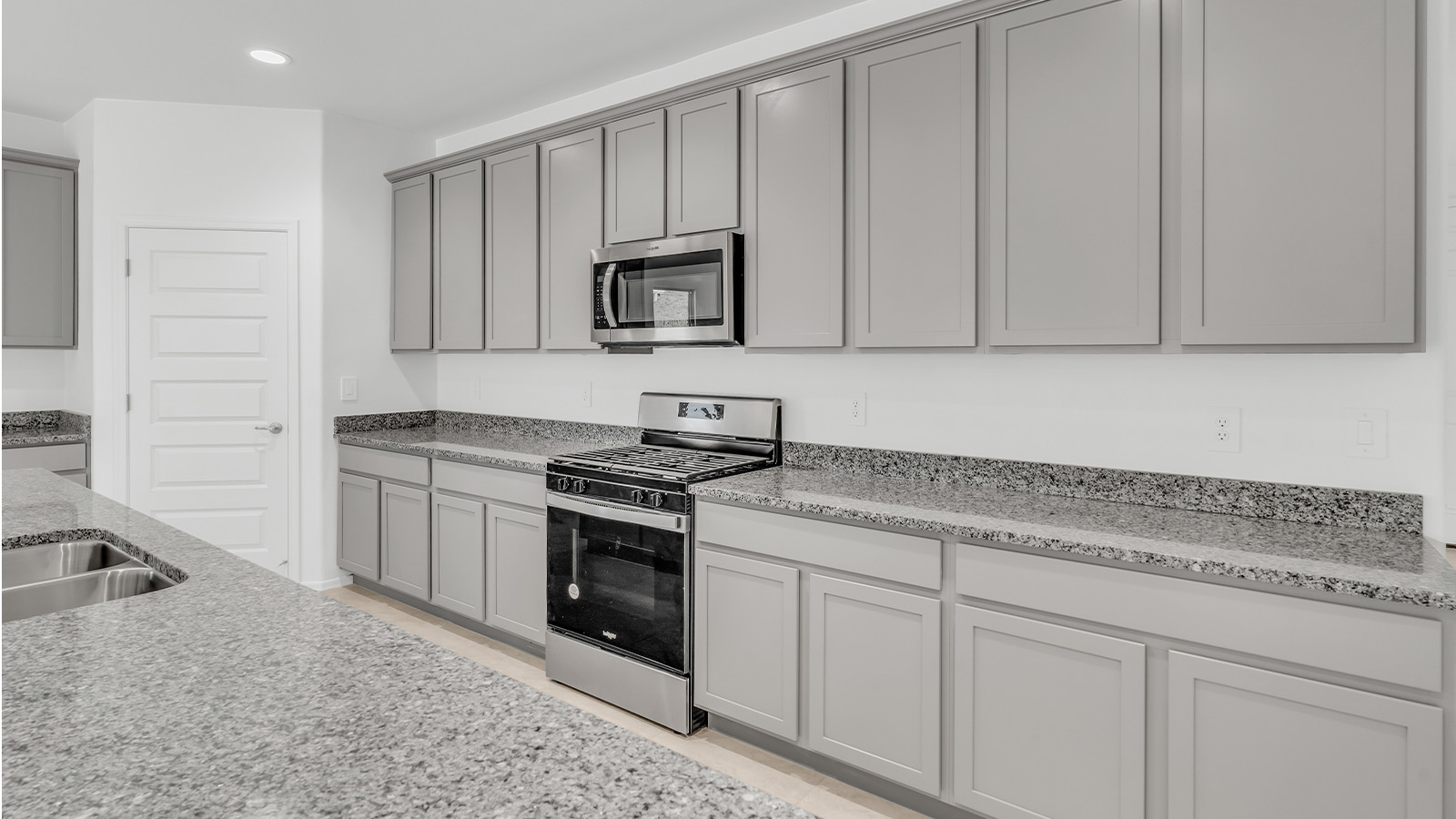 Welcome to The Citrine, a spacious single-story new home located in the tranquil Cholla Ridge neighborhood of Saguaro Bloom. With 2,577 square feet of well-planned living space, this home offers four bedrooms, three bathrooms, and a dedicated study, making it ideal for families who value both space and convenience.  As you enter through the inviting covered porch, you’re greeted by a bright and airy entryway that flows into the heart of the home. The expansive great room, dining area, and kitchen are thoughtfully connected, creating an ideal space for entertaining or simply enjoying time with family. The kitchen is a chef's dream, featuring a large island, granite countertops, and Shaker-style cabinetry in double espresso. A spacious pantry and modern stainless steel gas appliances ensure that this kitchen is both functional and stylish.  The Citrine’s layout includes a generously sized primary bedroom, carefully positioned for privacy at the rear of the home. This room features a large walk-in closet and an en-suite bathroom with dual executive-height vanities and a luxurious super shower. The additional three bedrooms are well-sized and located in separate areas of the home, ensuring privacy and easy access to two more full bathrooms.  One of the highlights of The Citrine is its versatile study, which can be used as a home office, library, media room, or extra bedroom depending on your needs. The large laundry room, conveniently situated near the bedrooms, adds to the home’s practicality.  The covered patio, accessible from the great room, offers a perfect spot for outdoor living, where you can enjoy Arizona’s beautiful weather throughout the year. Whether you’re hosting a barbecue or simply relaxing, this outdoor space enhances the home’s appeal.  Designed with energy efficiency and modern living in mind, The Citrine includes eco-friendly features and smart home technology, ensuring comfort and sustainability. Large windows throughout the home allow natural light to brighten every corner, creating a warm and welcoming atmosphere.  Located within the exclusive Cholla Ridge neighborhood at Saguaro Bloom, residents of The Citrine enjoy a range of premium features, including beautiful 12x24” tile flooring, gourmet kitchens, and 10’ ceilings in select homes. The community offers access to two pools, walking trails, parks, and more, all set against the picturesque backdrop of the Tucson Mountains.  The Citrine combines style, comfort, and practicality, making it a perfect place to call home in one of Marana’s most sought-after communities.