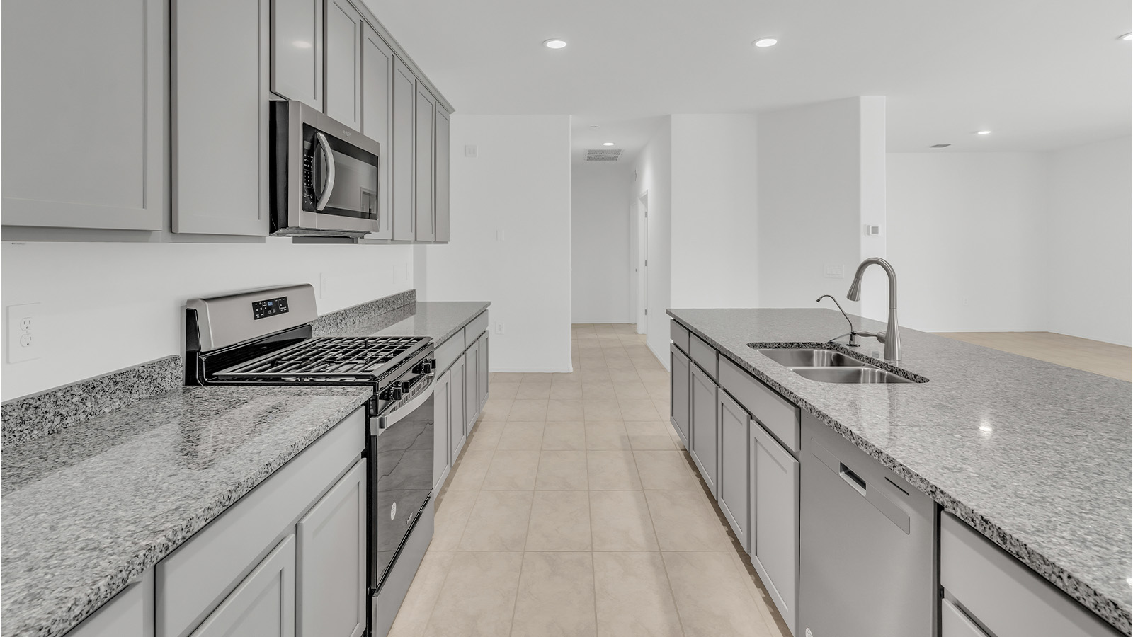 Welcome to The Citrine, a spacious single-story new home located in the tranquil Cholla Ridge neighborhood of Saguaro Bloom. With 2,577 square feet of well-planned living space, this home offers four bedrooms, three bathrooms, and a dedicated study, making it ideal for families who value both space and convenience.  As you enter through the inviting covered porch, you’re greeted by a bright and airy entryway that flows into the heart of the home. The expansive great room, dining area, and kitchen are thoughtfully connected, creating an ideal space for entertaining or simply enjoying time with family. The kitchen is a chef's dream, featuring a large island, granite countertops, and Shaker-style cabinetry in double espresso. A spacious pantry and modern stainless steel gas appliances ensure that this kitchen is both functional and stylish.  The Citrine’s layout includes a generously sized primary bedroom, carefully positioned for privacy at the rear of the home. This room features a large walk-in closet and an en-suite bathroom with dual executive-height vanities and a luxurious super shower. The additional three bedrooms are well-sized and located in separate areas of the home, ensuring privacy and easy access to two more full bathrooms.  One of the highlights of The Citrine is its versatile study, which can be used as a home office, library, media room, or extra bedroom depending on your needs. The large laundry room, conveniently situated near the bedrooms, adds to the home’s practicality.  The covered patio, accessible from the great room, offers a perfect spot for outdoor living, where you can enjoy Arizona’s beautiful weather throughout the year. Whether you’re hosting a barbecue or simply relaxing, this outdoor space enhances the home’s appeal.  Designed with energy efficiency and modern living in mind, The Citrine includes eco-friendly features and smart home technology, ensuring comfort and sustainability. Large windows throughout the home allow natural light to brighten every corner, creating a warm and welcoming atmosphere.  Located within the exclusive Cholla Ridge neighborhood at Saguaro Bloom, residents of The Citrine enjoy a range of premium features, including beautiful 12x24” tile flooring, gourmet kitchens, and 10’ ceilings in select homes. The community offers access to two pools, walking trails, parks, and more, all set against the picturesque backdrop of the Tucson Mountains.  The Citrine combines style, comfort, and practicality, making it a perfect place to call home in one of Marana’s most sought-after communities.