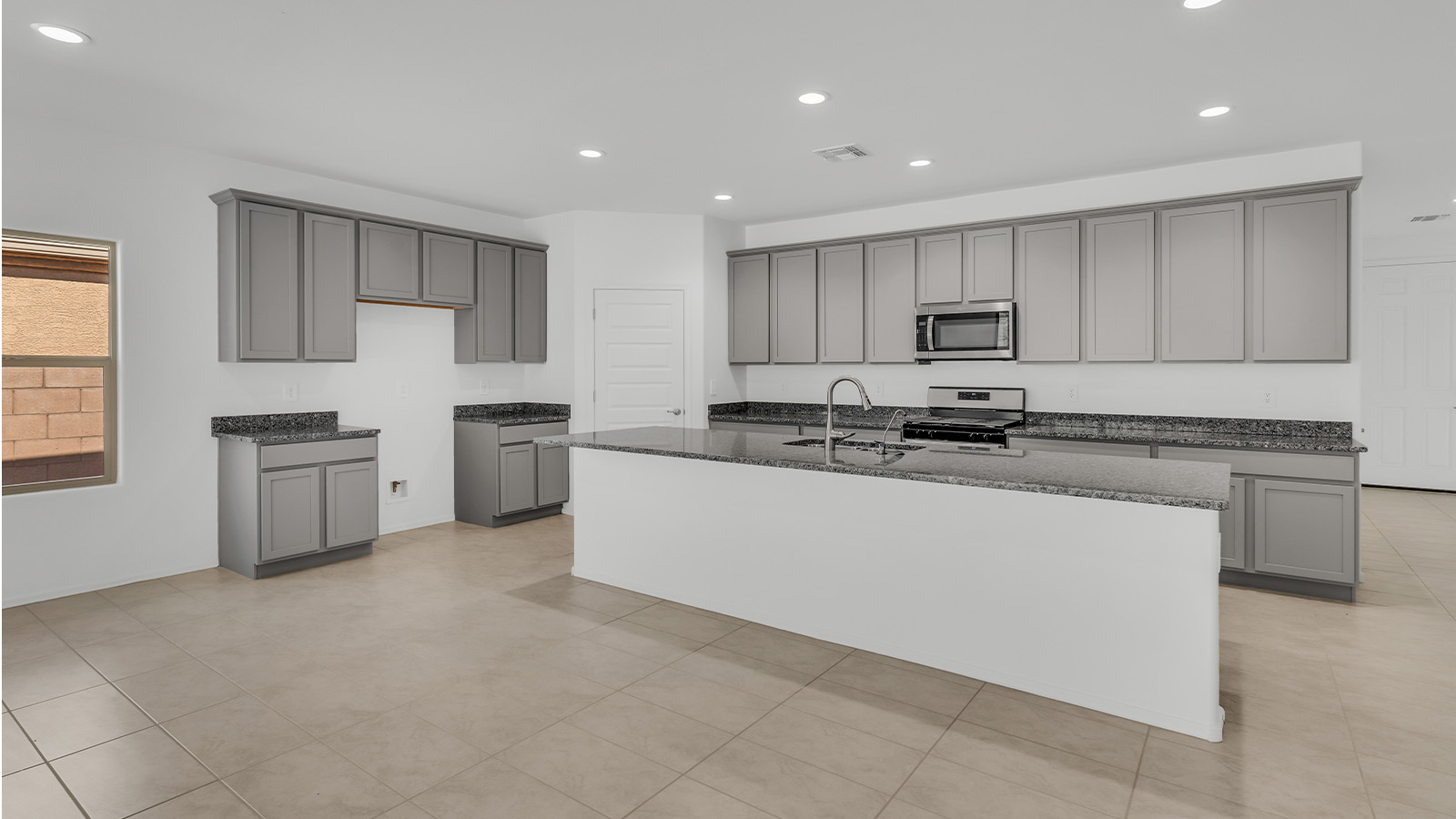 Welcome to The Citrine, a spacious single-story new home located in the tranquil Cholla Ridge neighborhood of Saguaro Bloom. With 2,577 square feet of well-planned living space, this home offers four bedrooms, three bathrooms, and a dedicated study, making it ideal for families who value both space and convenience.  As you enter through the inviting covered porch, you’re greeted by a bright and airy entryway that flows into the heart of the home. The expansive great room, dining area, and kitchen are thoughtfully connected, creating an ideal space for entertaining or simply enjoying time with family. The kitchen is a chef's dream, featuring a large island, granite countertops, and Shaker-style cabinetry in double espresso. A spacious pantry and modern stainless steel gas appliances ensure that this kitchen is both functional and stylish.  The Citrine’s layout includes a generously sized primary bedroom, carefully positioned for privacy at the rear of the home. This room features a large walk-in closet and an en-suite bathroom with dual executive-height vanities and a luxurious super shower. The additional three bedrooms are well-sized and located in separate areas of the home, ensuring privacy and easy access to two more full bathrooms.  One of the highlights of The Citrine is its versatile study, which can be used as a home office, library, media room, or extra bedroom depending on your needs. The large laundry room, conveniently situated near the bedrooms, adds to the home’s practicality.  The covered patio, accessible from the great room, offers a perfect spot for outdoor living, where you can enjoy Arizona’s beautiful weather throughout the year. Whether you’re hosting a barbecue or simply relaxing, this outdoor space enhances the home’s appeal.  Designed with energy efficiency and modern living in mind, The Citrine includes eco-friendly features and smart home technology, ensuring comfort and sustainability. Large windows throughout the home allow natural light to brighten every corner, creating a warm and welcoming atmosphere.  Located within the exclusive Cholla Ridge neighborhood at Saguaro Bloom, residents of The Citrine enjoy a range of premium features, including beautiful 12x24” tile flooring, gourmet kitchens, and 10’ ceilings in select homes. The community offers access to two pools, walking trails, parks, and more, all set against the picturesque backdrop of the Tucson Mountains.  The Citrine combines style, comfort, and practicality, making it a perfect place to call home in one of Marana’s most sought-after communities.