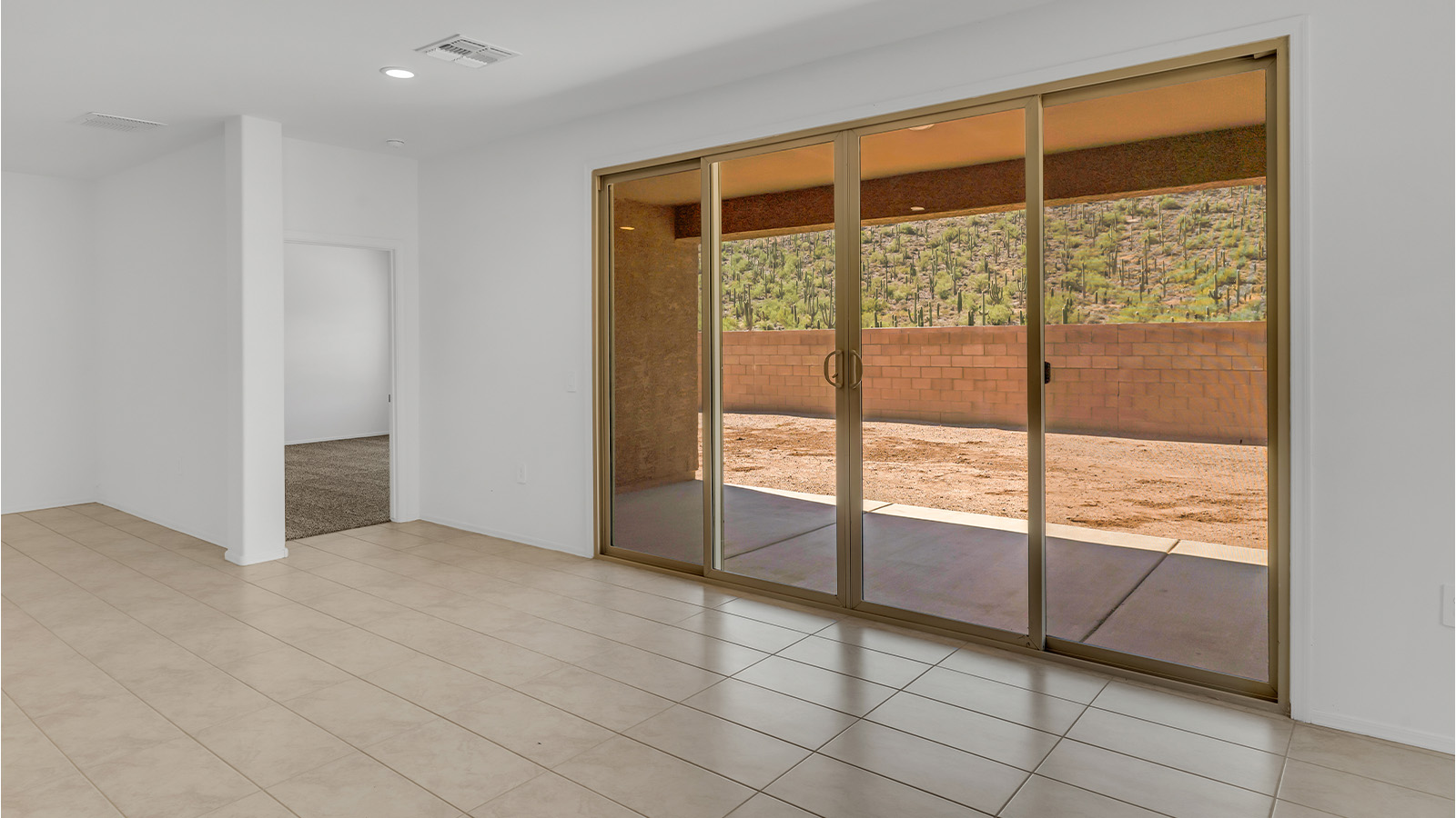 Welcome to The Citrine, a spacious single-story new home located in the tranquil Cholla Ridge neighborhood of Saguaro Bloom. With 2,577 square feet of well-planned living space, this home offers four bedrooms, three bathrooms, and a dedicated study, making it ideal for families who value both space and convenience.  As you enter through the inviting covered porch, you’re greeted by a bright and airy entryway that flows into the heart of the home. The expansive great room, dining area, and kitchen are thoughtfully connected, creating an ideal space for entertaining or simply enjoying time with family. The kitchen is a chef's dream, featuring a large island, granite countertops, and Shaker-style cabinetry in double espresso. A spacious pantry and modern stainless steel gas appliances ensure that this kitchen is both functional and stylish.  The Citrine’s layout includes a generously sized primary bedroom, carefully positioned for privacy at the rear of the home. This room features a large walk-in closet and an en-suite bathroom with dual executive-height vanities and a luxurious super shower. The additional three bedrooms are well-sized and located in separate areas of the home, ensuring privacy and easy access to two more full bathrooms.  One of the highlights of The Citrine is its versatile study, which can be used as a home office, library, media room, or extra bedroom depending on your needs. The large laundry room, conveniently situated near the bedrooms, adds to the home’s practicality.  The covered patio, accessible from the great room, offers a perfect spot for outdoor living, where you can enjoy Arizona’s beautiful weather throughout the year. Whether you’re hosting a barbecue or simply relaxing, this outdoor space enhances the home’s appeal.  Designed with energy efficiency and modern living in mind, The Citrine includes eco-friendly features and smart home technology, ensuring comfort and sustainability. Large windows throughout the home allow natural light to brighten every corner, creating a warm and welcoming atmosphere.  Located within the exclusive Cholla Ridge neighborhood at Saguaro Bloom, residents of The Citrine enjoy a range of premium features, including beautiful 12x24” tile flooring, gourmet kitchens, and 10’ ceilings in select homes. The community offers access to two pools, walking trails, parks, and more, all set against the picturesque backdrop of the Tucson Mountains.  The Citrine combines style, comfort, and practicality, making it a perfect place to call home in one of Marana’s most sought-after communities.