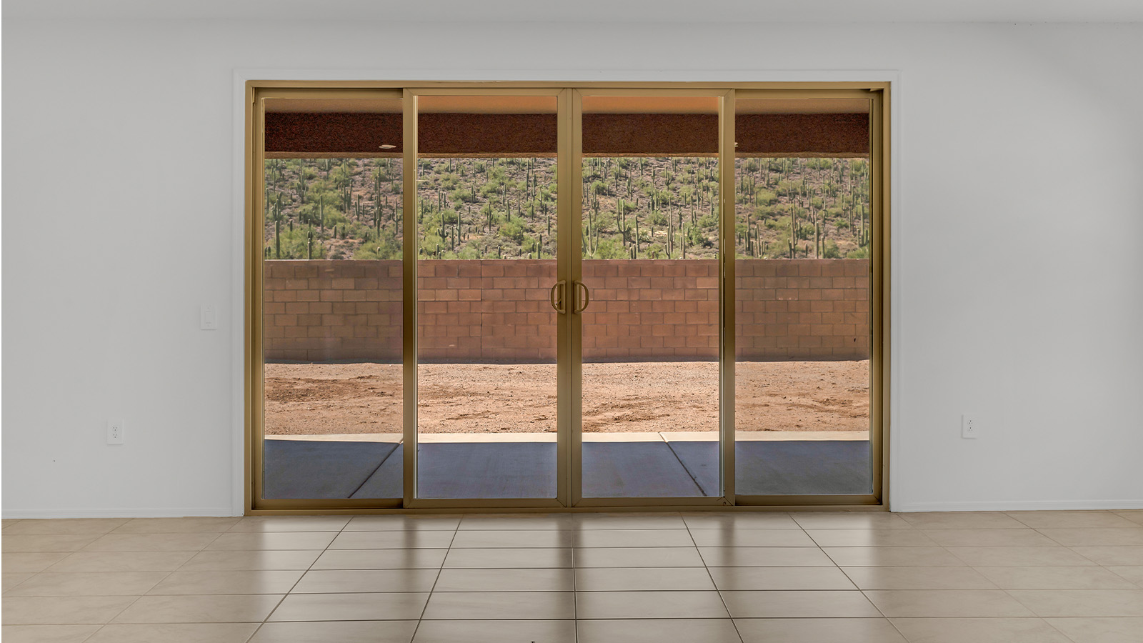 Welcome to The Citrine, a spacious single-story new home located in the tranquil Cholla Ridge neighborhood of Saguaro Bloom. With 2,577 square feet of well-planned living space, this home offers four bedrooms, three bathrooms, and a dedicated study, making it ideal for families who value both space and convenience.  As you enter through the inviting covered porch, you’re greeted by a bright and airy entryway that flows into the heart of the home. The expansive great room, dining area, and kitchen are thoughtfully connected, creating an ideal space for entertaining or simply enjoying time with family. The kitchen is a chef's dream, featuring a large island, granite countertops, and Shaker-style cabinetry in double espresso. A spacious pantry and modern stainless steel gas appliances ensure that this kitchen is both functional and stylish.  The Citrine’s layout includes a generously sized primary bedroom, carefully positioned for privacy at the rear of the home. This room features a large walk-in closet and an en-suite bathroom with dual executive-height vanities and a luxurious super shower. The additional three bedrooms are well-sized and located in separate areas of the home, ensuring privacy and easy access to two more full bathrooms.  One of the highlights of The Citrine is its versatile study, which can be used as a home office, library, media room, or extra bedroom depending on your needs. The large laundry room, conveniently situated near the bedrooms, adds to the home’s practicality.  The covered patio, accessible from the great room, offers a perfect spot for outdoor living, where you can enjoy Arizona’s beautiful weather throughout the year. Whether you’re hosting a barbecue or simply relaxing, this outdoor space enhances the home’s appeal.  Designed with energy efficiency and modern living in mind, The Citrine includes eco-friendly features and smart home technology, ensuring comfort and sustainability. Large windows throughout the home allow natural light to brighten every corner, creating a warm and welcoming atmosphere.  Located within the exclusive Cholla Ridge neighborhood at Saguaro Bloom, residents of The Citrine enjoy a range of premium features, including beautiful 12x24” tile flooring, gourmet kitchens, and 10’ ceilings in select homes. The community offers access to two pools, walking trails, parks, and more, all set against the picturesque backdrop of the Tucson Mountains.  The Citrine combines style, comfort, and practicality, making it a perfect place to call home in one of Marana’s most sought-after communities.