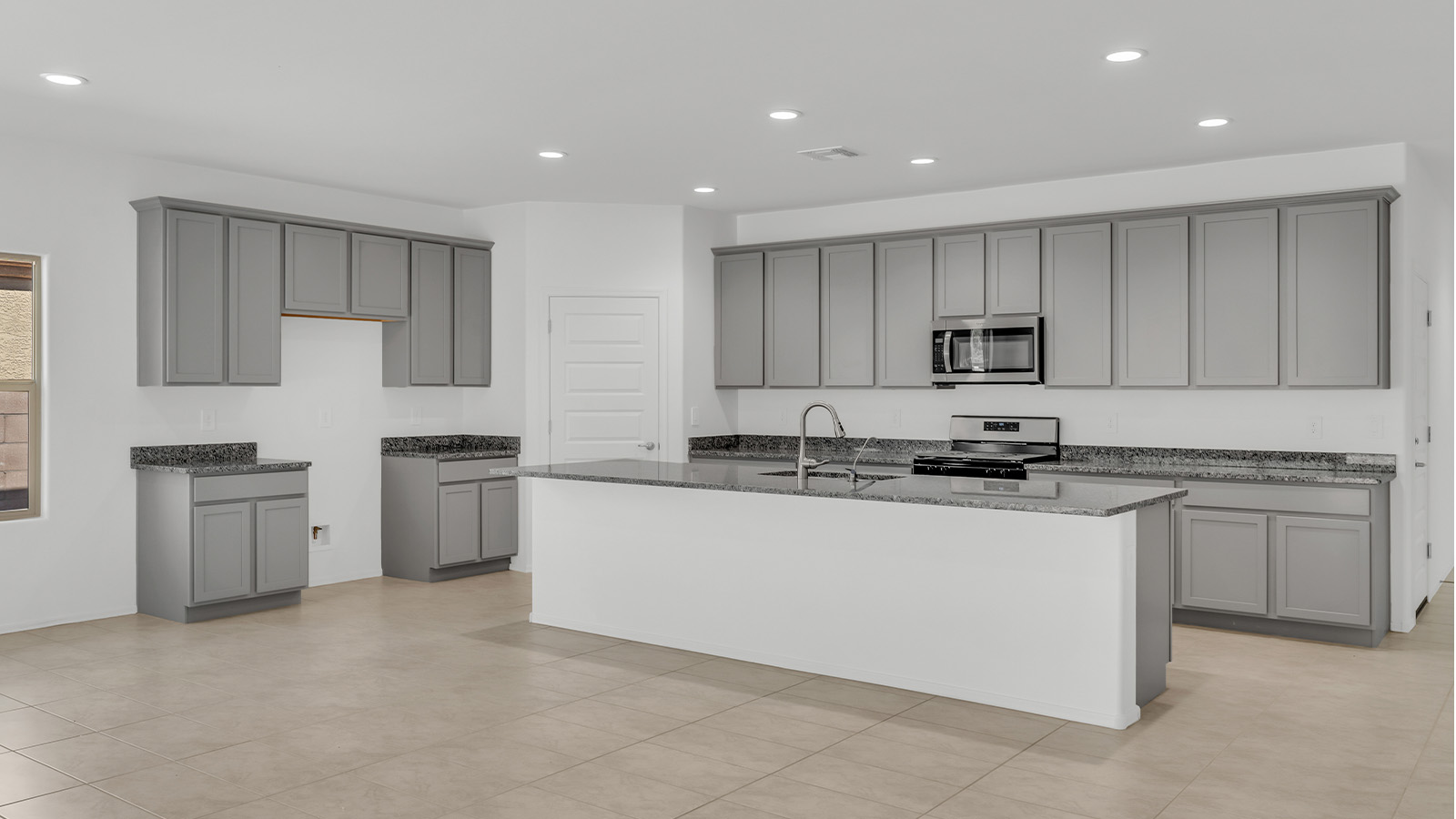 Welcome to The Citrine, a spacious single-story new home located in the tranquil Cholla Ridge neighborhood of Saguaro Bloom. With 2,577 square feet of well-planned living space, this home offers four bedrooms, three bathrooms, and a dedicated study, making it ideal for families who value both space and convenience.  As you enter through the inviting covered porch, you’re greeted by a bright and airy entryway that flows into the heart of the home. The expansive great room, dining area, and kitchen are thoughtfully connected, creating an ideal space for entertaining or simply enjoying time with family. The kitchen is a chef's dream, featuring a large island, granite countertops, and Shaker-style cabinetry in double espresso. A spacious pantry and modern stainless steel gas appliances ensure that this kitchen is both functional and stylish.  The Citrine’s layout includes a generously sized primary bedroom, carefully positioned for privacy at the rear of the home. This room features a large walk-in closet and an en-suite bathroom with dual executive-height vanities and a luxurious super shower. The additional three bedrooms are well-sized and located in separate areas of the home, ensuring privacy and easy access to two more full bathrooms.  One of the highlights of The Citrine is its versatile study, which can be used as a home office, library, media room, or extra bedroom depending on your needs. The large laundry room, conveniently situated near the bedrooms, adds to the home’s practicality.  The covered patio, accessible from the great room, offers a perfect spot for outdoor living, where you can enjoy Arizona’s beautiful weather throughout the year. Whether you’re hosting a barbecue or simply relaxing, this outdoor space enhances the home’s appeal.  Designed with energy efficiency and modern living in mind, The Citrine includes eco-friendly features and smart home technology, ensuring comfort and sustainability. Large windows throughout the home allow natural light to brighten every corner, creating a warm and welcoming atmosphere.  Located within the exclusive Cholla Ridge neighborhood at Saguaro Bloom, residents of The Citrine enjoy a range of premium features, including beautiful 12x24” tile flooring, gourmet kitchens, and 10’ ceilings in select homes. The community offers access to two pools, walking trails, parks, and more, all set against the picturesque backdrop of the Tucson Mountains.  The Citrine combines style, comfort, and practicality, making it a perfect place to call home in one of Marana’s most sought-after communities.