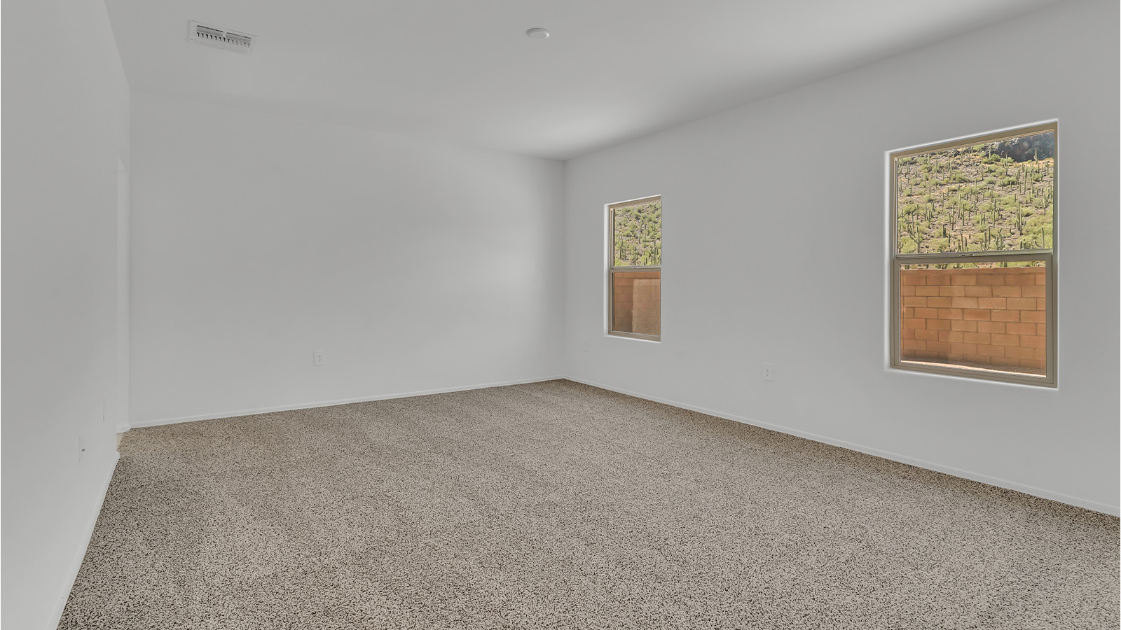 Welcome to The Citrine, a spacious single-story new home located in the tranquil Cholla Ridge neighborhood of Saguaro Bloom. With 2,577 square feet of well-planned living space, this home offers four bedrooms, three bathrooms, and a dedicated study, making it ideal for families who value both space and convenience.  As you enter through the inviting covered porch, you’re greeted by a bright and airy entryway that flows into the heart of the home. The expansive great room, dining area, and kitchen are thoughtfully connected, creating an ideal space for entertaining or simply enjoying time with family. The kitchen is a chef's dream, featuring a large island, granite countertops, and Shaker-style cabinetry in double espresso. A spacious pantry and modern stainless steel gas appliances ensure that this kitchen is both functional and stylish.  The Citrine’s layout includes a generously sized primary bedroom, carefully positioned for privacy at the rear of the home. This room features a large walk-in closet and an en-suite bathroom with dual executive-height vanities and a luxurious super shower. The additional three bedrooms are well-sized and located in separate areas of the home, ensuring privacy and easy access to two more full bathrooms.  One of the highlights of The Citrine is its versatile study, which can be used as a home office, library, media room, or extra bedroom depending on your needs. The large laundry room, conveniently situated near the bedrooms, adds to the home’s practicality.  The covered patio, accessible from the great room, offers a perfect spot for outdoor living, where you can enjoy Arizona’s beautiful weather throughout the year. Whether you’re hosting a barbecue or simply relaxing, this outdoor space enhances the home’s appeal.  Designed with energy efficiency and modern living in mind, The Citrine includes eco-friendly features and smart home technology, ensuring comfort and sustainability. Large windows throughout the home allow natural light to brighten every corner, creating a warm and welcoming atmosphere.  Located within the exclusive Cholla Ridge neighborhood at Saguaro Bloom, residents of The Citrine enjoy a range of premium features, including beautiful 12x24” tile flooring, gourmet kitchens, and 10’ ceilings in select homes. The community offers access to two pools, walking trails, parks, and more, all set against the picturesque backdrop of the Tucson Mountains.  The Citrine combines style, comfort, and practicality, making it a perfect place to call home in one of Marana’s most sought-after communities.