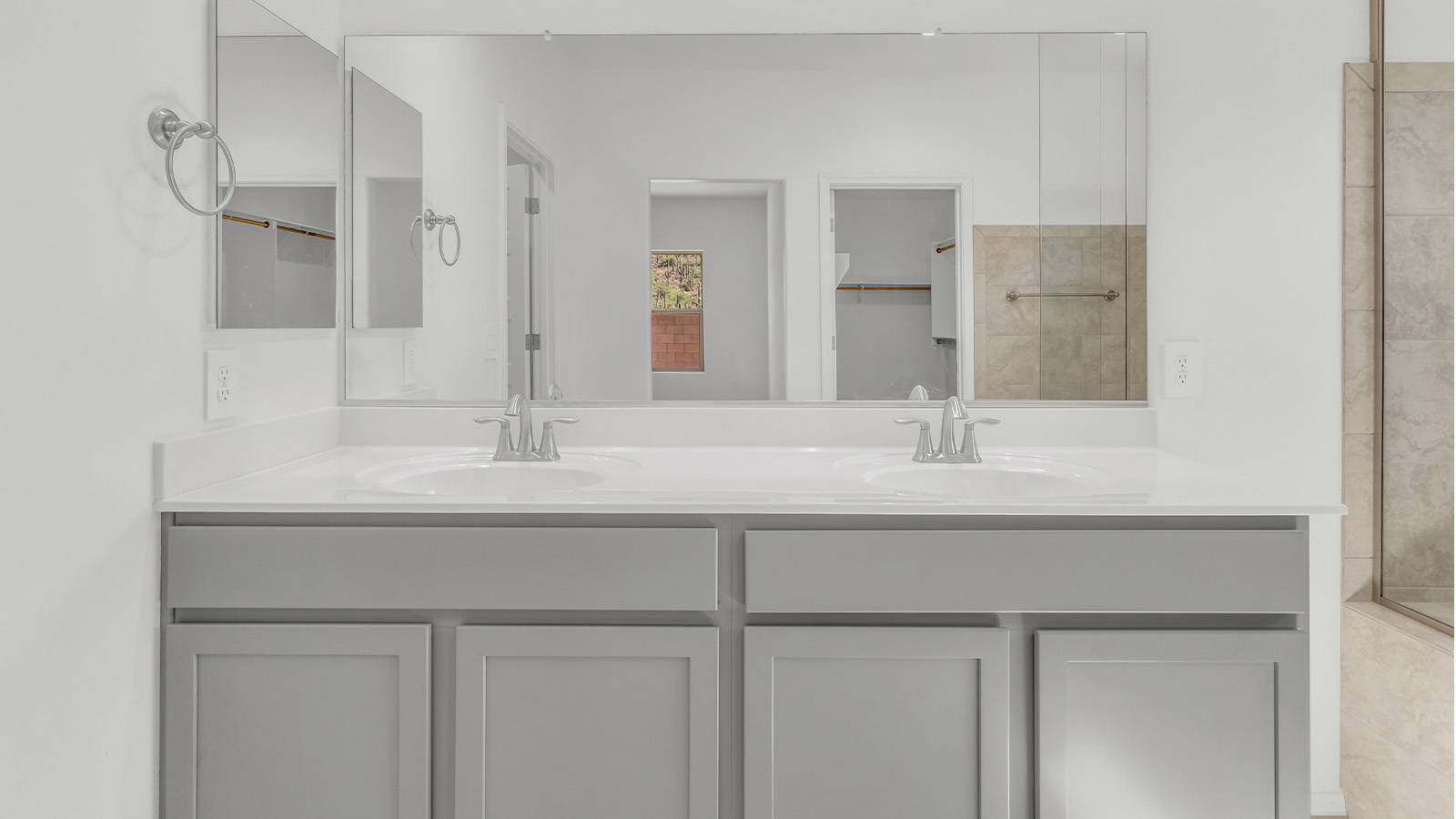 Welcome to The Citrine, a spacious single-story new home located in the tranquil Cholla Ridge neighborhood of Saguaro Bloom. With 2,577 square feet of well-planned living space, this home offers four bedrooms, three bathrooms, and a dedicated study, making it ideal for families who value both space and convenience.  As you enter through the inviting covered porch, you’re greeted by a bright and airy entryway that flows into the heart of the home. The expansive great room, dining area, and kitchen are thoughtfully connected, creating an ideal space for entertaining or simply enjoying time with family. The kitchen is a chef's dream, featuring a large island, granite countertops, and Shaker-style cabinetry in double espresso. A spacious pantry and modern stainless steel gas appliances ensure that this kitchen is both functional and stylish.  The Citrine’s layout includes a generously sized primary bedroom, carefully positioned for privacy at the rear of the home. This room features a large walk-in closet and an en-suite bathroom with dual executive-height vanities and a luxurious super shower. The additional three bedrooms are well-sized and located in separate areas of the home, ensuring privacy and easy access to two more full bathrooms.  One of the highlights of The Citrine is its versatile study, which can be used as a home office, library, media room, or extra bedroom depending on your needs. The large laundry room, conveniently situated near the bedrooms, adds to the home’s practicality.  The covered patio, accessible from the great room, offers a perfect spot for outdoor living, where you can enjoy Arizona’s beautiful weather throughout the year. Whether you’re hosting a barbecue or simply relaxing, this outdoor space enhances the home’s appeal.  Designed with energy efficiency and modern living in mind, The Citrine includes eco-friendly features and smart home technology, ensuring comfort and sustainability. Large windows throughout the home allow natural light to brighten every corner, creating a warm and welcoming atmosphere.  Located within the exclusive Cholla Ridge neighborhood at Saguaro Bloom, residents of The Citrine enjoy a range of premium features, including beautiful 12x24” tile flooring, gourmet kitchens, and 10’ ceilings in select homes. The community offers access to two pools, walking trails, parks, and more, all set against the picturesque backdrop of the Tucson Mountains.  The Citrine combines style, comfort, and practicality, making it a perfect place to call home in one of Marana’s most sought-after communities.