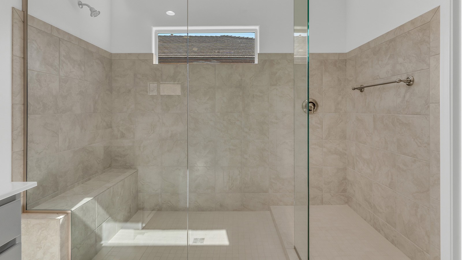 Welcome to The Citrine, a spacious single-story new home located in the tranquil Cholla Ridge neighborhood of Saguaro Bloom. With 2,577 square feet of well-planned living space, this home offers four bedrooms, three bathrooms, and a dedicated study, making it ideal for families who value both space and convenience.  As you enter through the inviting covered porch, you’re greeted by a bright and airy entryway that flows into the heart of the home. The expansive great room, dining area, and kitchen are thoughtfully connected, creating an ideal space for entertaining or simply enjoying time with family. The kitchen is a chef's dream, featuring a large island, granite countertops, and Shaker-style cabinetry in double espresso. A spacious pantry and modern stainless steel gas appliances ensure that this kitchen is both functional and stylish.  The Citrine’s layout includes a generously sized primary bedroom, carefully positioned for privacy at the rear of the home. This room features a large walk-in closet and an en-suite bathroom with dual executive-height vanities and a luxurious super shower. The additional three bedrooms are well-sized and located in separate areas of the home, ensuring privacy and easy access to two more full bathrooms.  One of the highlights of The Citrine is its versatile study, which can be used as a home office, library, media room, or extra bedroom depending on your needs. The large laundry room, conveniently situated near the bedrooms, adds to the home’s practicality.  The covered patio, accessible from the great room, offers a perfect spot for outdoor living, where you can enjoy Arizona’s beautiful weather throughout the year. Whether you’re hosting a barbecue or simply relaxing, this outdoor space enhances the home’s appeal.  Designed with energy efficiency and modern living in mind, The Citrine includes eco-friendly features and smart home technology, ensuring comfort and sustainability. Large windows throughout the home allow natural light to brighten every corner, creating a warm and welcoming atmosphere.  Located within the exclusive Cholla Ridge neighborhood at Saguaro Bloom, residents of The Citrine enjoy a range of premium features, including beautiful 12x24” tile flooring, gourmet kitchens, and 10’ ceilings in select homes. The community offers access to two pools, walking trails, parks, and more, all set against the picturesque backdrop of the Tucson Mountains.  The Citrine combines style, comfort, and practicality, making it a perfect place to call home in one of Marana’s most sought-after communities.