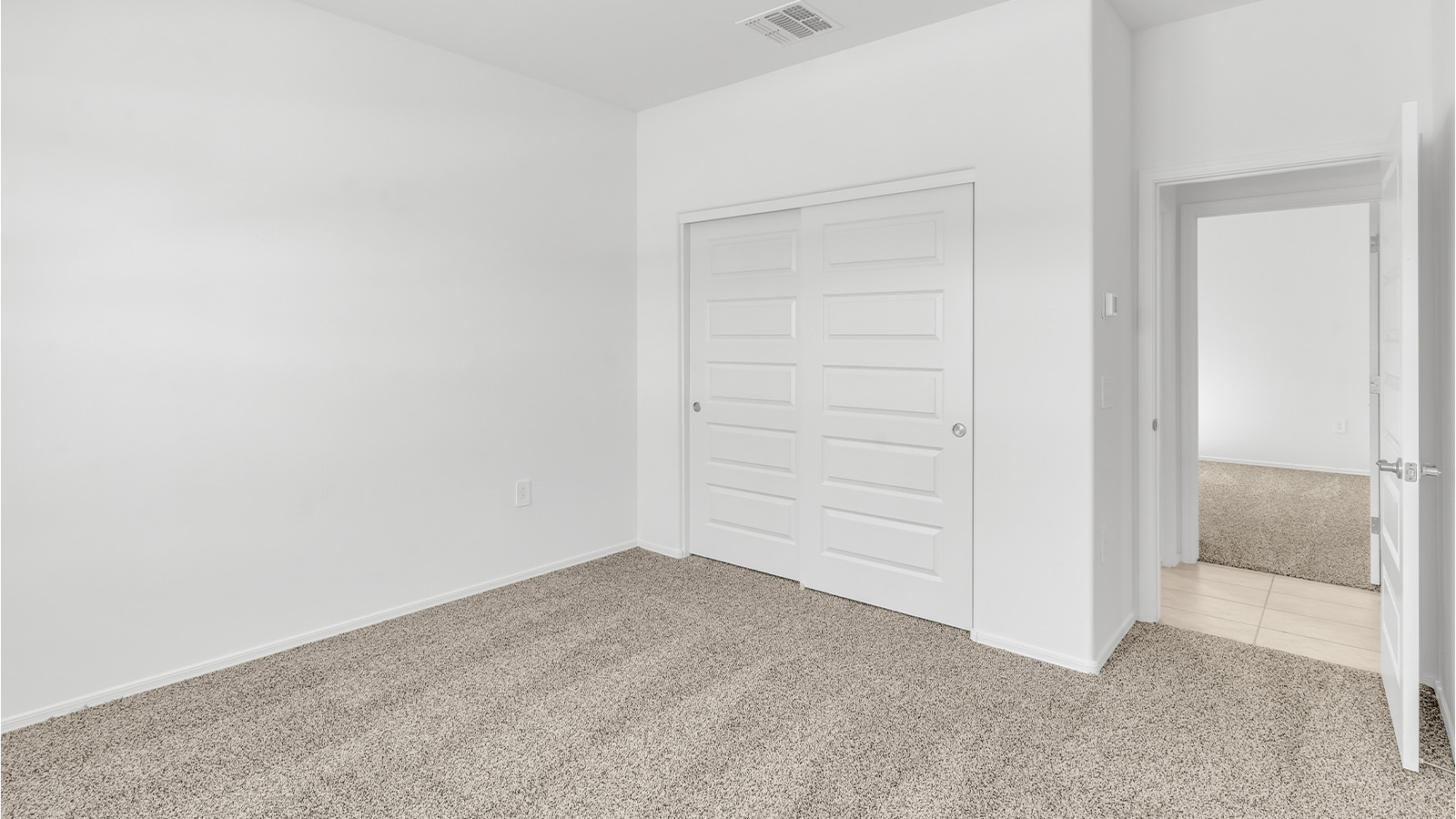 Welcome to The Citrine, a spacious single-story new home located in the tranquil Cholla Ridge neighborhood of Saguaro Bloom. With 2,577 square feet of well-planned living space, this home offers four bedrooms, three bathrooms, and a dedicated study, making it ideal for families who value both space and convenience.  As you enter through the inviting covered porch, you’re greeted by a bright and airy entryway that flows into the heart of the home. The expansive great room, dining area, and kitchen are thoughtfully connected, creating an ideal space for entertaining or simply enjoying time with family. The kitchen is a chef's dream, featuring a large island, granite countertops, and Shaker-style cabinetry in double espresso. A spacious pantry and modern stainless steel gas appliances ensure that this kitchen is both functional and stylish.  The Citrine’s layout includes a generously sized primary bedroom, carefully positioned for privacy at the rear of the home. This room features a large walk-in closet and an en-suite bathroom with dual executive-height vanities and a luxurious super shower. The additional three bedrooms are well-sized and located in separate areas of the home, ensuring privacy and easy access to two more full bathrooms.  One of the highlights of The Citrine is its versatile study, which can be used as a home office, library, media room, or extra bedroom depending on your needs. The large laundry room, conveniently situated near the bedrooms, adds to the home’s practicality.  The covered patio, accessible from the great room, offers a perfect spot for outdoor living, where you can enjoy Arizona’s beautiful weather throughout the year. Whether you’re hosting a barbecue or simply relaxing, this outdoor space enhances the home’s appeal.  Designed with energy efficiency and modern living in mind, The Citrine includes eco-friendly features and smart home technology, ensuring comfort and sustainability. Large windows throughout the home allow natural light to brighten every corner, creating a warm and welcoming atmosphere.  Located within the exclusive Cholla Ridge neighborhood at Saguaro Bloom, residents of The Citrine enjoy a range of premium features, including beautiful 12x24” tile flooring, gourmet kitchens, and 10’ ceilings in select homes. The community offers access to two pools, walking trails, parks, and more, all set against the picturesque backdrop of the Tucson Mountains.  The Citrine combines style, comfort, and practicality, making it a perfect place to call home in one of Marana’s most sought-after communities.