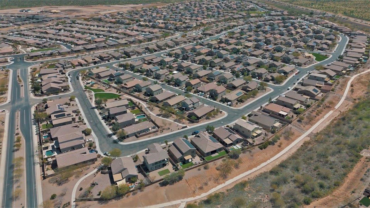 Welcome to The Citrine, a spacious single-story new home located in the tranquil Cholla Ridge neighborhood of Saguaro Bloom. With 2,577 square feet of well-planned living space, this home offers four bedrooms, three bathrooms, and a dedicated study, making it ideal for families who value both space and convenience.  As you enter through the inviting covered porch, you’re greeted by a bright and airy entryway that flows into the heart of the home. The expansive great room, dining area, and kitchen are thoughtfully connected, creating an ideal space for entertaining or simply enjoying time with family. The kitchen is a chef's dream, featuring a large island, granite countertops, and Shaker-style cabinetry in double espresso. A spacious pantry and modern stainless steel gas appliances ensure that this kitchen is both functional and stylish.  The Citrine’s layout includes a generously sized primary bedroom, carefully positioned for privacy at the rear of the home. This room features a large walk-in closet and an en-suite bathroom with dual executive-height vanities and a luxurious super shower. The additional three bedrooms are well-sized and located in separate areas of the home, ensuring privacy and easy access to two more full bathrooms.  One of the highlights of The Citrine is its versatile study, which can be used as a home office, library, media room, or extra bedroom depending on your needs. The large laundry room, conveniently situated near the bedrooms, adds to the home’s practicality.  The covered patio, accessible from the great room, offers a perfect spot for outdoor living, where you can enjoy Arizona’s beautiful weather throughout the year. Whether you’re hosting a barbecue or simply relaxing, this outdoor space enhances the home’s appeal.  Designed with energy efficiency and modern living in mind, The Citrine includes eco-friendly features and smart home technology, ensuring comfort and sustainability. Large windows throughout the home allow natural light to brighten every corner, creating a warm and welcoming atmosphere.  Located within the exclusive Cholla Ridge neighborhood at Saguaro Bloom, residents of The Citrine enjoy a range of premium features, including beautiful 12x24” tile flooring, gourmet kitchens, and 10’ ceilings in select homes. The community offers access to two pools, walking trails, parks, and more, all set against the picturesque backdrop of the Tucson Mountains.  The Citrine combines style, comfort, and practicality, making it a perfect place to call home in one of Marana’s most sought-after communities.