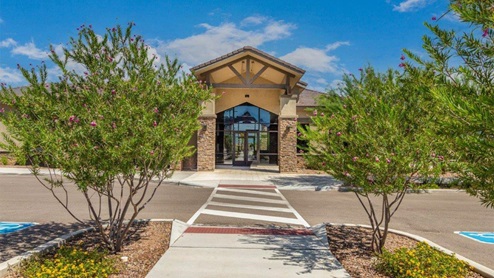 Explore New Homes at Saguaro Bloom by D.R. Horton – A Master-Planned Community in Marana, AZ. Nestled in the foothills of the breathtaking Tucson Mountains, Saguaro Bloom by D.R. Horton is a premier master-planned community in Northwest Marana that offers an exceptional living experience. Saguaro Bloom is divided into distinct neighborhoods, each offering its unique charm and amenities. *Mesquite at Saguaro Bloom* is located in Block 1 and offers a variety of spacious floorplans with 18x18 tile flooring, granite countertops in kitchen and bathrooms, and Shaker-style cabinets in white or gray. These homes feature 9’ ceilings on the first floor, island kitchens, and the Home is Connected® Smart Home package, making them perfect for modern living. *Agave at Saguaro Bloom*, situated in Block 7C, features homes with stunning 6x36” wood-look tile in gray, quartz countertops in kitchen and bathrooms, and Shaker-style cabinets. These homes are designed with stylish interiors and modern conveniences, including LED disc lighting and energy-efficient tankless water heaters. *Cholla Ridge at Saguaro Bloom*, located in Block 7B, offers single-story homes on lots with no rear neighbors. These homes are distinguished by beautiful 12x24” tile flooring, gourmet kitchens, and 10’ ceilings in select homes. With 8’ sliding glass patio doors and super showers, Cholla Ridge combines luxury and privacy in a serene setting. All homes in Saguaro Bloom are built with a Spanish lace stucco exterior, tile roofs, landscaped front yards with auto drip irrigation, and large, fully fenced backyards ready for your design. The homes also include covered front porches and back patios, stainless steel gas appliances, and executive height vanities in all bathrooms. Additionally, as of August 2024, all homes starting production are Zero Energy Ready, meeting rigorous energy efficiency standards that significantly reduce energy costs and environmental impact. Residents of Saguaro Bloom enjoy an array of community amenities, including a clubhouse, two pools with lap lanes and lagoon entry, a fitness center, a splash pad, and over 30 miles of walking trails. The community also features more than 20 pocket parks, playgrounds, and coming soon, a large community park with tennis, pickleball, soccer, baseball, and a dog park. Saguaro Bloom is truly a lifestyle community, offering regular events like Food Truck Thursdays, Movies at the Pool, and holiday decorating contests, all fostering a strong sense of community. Located in the highly-rated Marana Unified School District, Saguaro Bloom is close to excellent schools, including Rattlesnake Ridge Elementary, Marana Middle School, and Marana High School. The community’s location offers a perfect balance of seclusion and convenience, with quick access to I-10, grocery stores, restaurants, and the Twin Peaks Outlet, all within minutes. Downtown Tucson, with its vibrant arts, culture, and entertainment scene, is just a short 15-minute drive away. Surrounded by the natural beauty of the desert landscape, residents can explore nearby outdoor attractions like Saguaro National Park West, the Arizona Desert Museum, and Quarry Pines Golf Course. Whether you enjoy hiking, biking, or simply taking in the stunning views, Saguaro Bloom offers an unparalleled lifestyle in one of Arizona’s most sought-after locations. Discover the perfect blend of modern amenities, scenic beauty, and a strong sense of community at Saguaro Bloom by D.R. Horton – where your new home awaits in Marana, AZ.