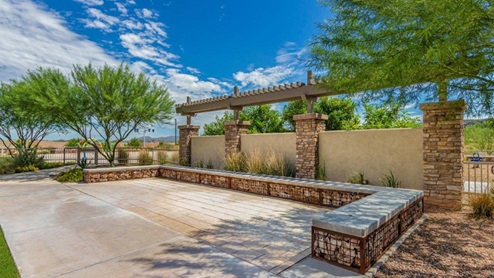 Explore New Homes at Saguaro Bloom by D.R. Horton – A Master-Planned Community in Marana, AZ. Nestled in the foothills of the breathtaking Tucson Mountains, Saguaro Bloom by D.R. Horton is a premier master-planned community in Northwest Marana that offers an exceptional living experience. Saguaro Bloom is divided into distinct neighborhoods, each offering its unique charm and amenities. *Mesquite at Saguaro Bloom* is located in Block 1 and offers a variety of spacious floorplans with 18x18 tile flooring, granite countertops in kitchen and bathrooms, and Shaker-style cabinets in white or gray. These homes feature 9’ ceilings on the first floor, island kitchens, and the Home is Connected® Smart Home package, making them perfect for modern living. *Agave at Saguaro Bloom*, situated in Block 7C, features homes with stunning 6x36” wood-look tile in gray, quartz countertops in kitchen and bathrooms, and Shaker-style cabinets. These homes are designed with stylish interiors and modern conveniences, including LED disc lighting and energy-efficient tankless water heaters. *Cholla Ridge at Saguaro Bloom*, located in Block 7B, offers single-story homes on lots with no rear neighbors. These homes are distinguished by beautiful 12x24” tile flooring, gourmet kitchens, and 10’ ceilings in select homes. With 8’ sliding glass patio doors and super showers, Cholla Ridge combines luxury and privacy in a serene setting. All homes in Saguaro Bloom are built with a Spanish lace stucco exterior, tile roofs, landscaped front yards with auto drip irrigation, and large, fully fenced backyards ready for your design. The homes also include covered front porches and back patios, stainless steel gas appliances, and executive height vanities in all bathrooms. Additionally, as of August 2024, all homes starting production are Zero Energy Ready, meeting rigorous energy efficiency standards that significantly reduce energy costs and environmental impact. Residents of Saguaro Bloom enjoy an array of community amenities, including a clubhouse, two pools with lap lanes and lagoon entry, a fitness center, a splash pad, and over 30 miles of walking trails. The community also features more than 20 pocket parks, playgrounds, and coming soon, a large community park with tennis, pickleball, soccer, baseball, and a dog park. Saguaro Bloom is truly a lifestyle community, offering regular events like Food Truck Thursdays, Movies at the Pool, and holiday decorating contests, all fostering a strong sense of community. Located in the highly-rated Marana Unified School District, Saguaro Bloom is close to excellent schools, including Rattlesnake Ridge Elementary, Marana Middle School, and Marana High School. The community’s location offers a perfect balance of seclusion and convenience, with quick access to I-10, grocery stores, restaurants, and the Twin Peaks Outlet, all within minutes. Downtown Tucson, with its vibrant arts, culture, and entertainment scene, is just a short 15-minute drive away. Surrounded by the natural beauty of the desert landscape, residents can explore nearby outdoor attractions like Saguaro National Park West, the Arizona Desert Museum, and Quarry Pines Golf Course. Whether you enjoy hiking, biking, or simply taking in the stunning views, Saguaro Bloom offers an unparalleled lifestyle in one of Arizona’s most sought-after locations. Discover the perfect blend of modern amenities, scenic beauty, and a strong sense of community at Saguaro Bloom by D.R. Horton – where your new home awaits in Marana, AZ.