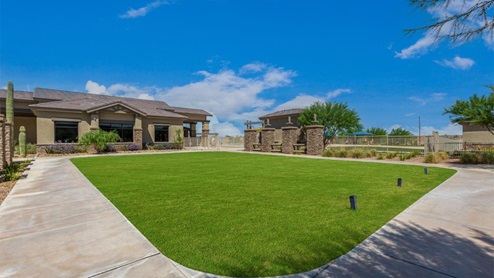 Explore New Homes at Saguaro Bloom by D.R. Horton – A Master-Planned Community in Marana, AZ. Nestled in the foothills of the breathtaking Tucson Mountains, Saguaro Bloom by D.R. Horton is a premier master-planned community in Northwest Marana that offers an exceptional living experience. Saguaro Bloom is divided into distinct neighborhoods, each offering its unique charm and amenities. *Mesquite at Saguaro Bloom* is located in Block 1 and offers a variety of spacious floorplans with 18x18 tile flooring, granite countertops in kitchen and bathrooms, and Shaker-style cabinets in white or gray. These homes feature 9’ ceilings on the first floor, island kitchens, and the Home is Connected® Smart Home package, making them perfect for modern living. *Agave at Saguaro Bloom*, situated in Block 7C, features homes with stunning 6x36” wood-look tile in gray, quartz countertops in kitchen and bathrooms, and Shaker-style cabinets. These homes are designed with stylish interiors and modern conveniences, including LED disc lighting and energy-efficient tankless water heaters. *Cholla Ridge at Saguaro Bloom*, located in Block 7B, offers single-story homes on lots with no rear neighbors. These homes are distinguished by beautiful 12x24” tile flooring, gourmet kitchens, and 10’ ceilings in select homes. With 8’ sliding glass patio doors and super showers, Cholla Ridge combines luxury and privacy in a serene setting. All homes in Saguaro Bloom are built with a Spanish lace stucco exterior, tile roofs, landscaped front yards with auto drip irrigation, and large, fully fenced backyards ready for your design. The homes also include covered front porches and back patios, stainless steel gas appliances, and executive height vanities in all bathrooms. Additionally, as of August 2024, all homes starting production are Zero Energy Ready, meeting rigorous energy efficiency standards that significantly reduce energy costs and environmental impact. Residents of Saguaro Bloom enjoy an array of community amenities, including a clubhouse, two pools with lap lanes and lagoon entry, a fitness center, a splash pad, and over 30 miles of walking trails. The community also features more than 20 pocket parks, playgrounds, and coming soon, a large community park with tennis, pickleball, soccer, baseball, and a dog park. Saguaro Bloom is truly a lifestyle community, offering regular events like Food Truck Thursdays, Movies at the Pool, and holiday decorating contests, all fostering a strong sense of community. Located in the highly-rated Marana Unified School District, Saguaro Bloom is close to excellent schools, including Rattlesnake Ridge Elementary, Marana Middle School, and Marana High School. The community’s location offers a perfect balance of seclusion and convenience, with quick access to I-10, grocery stores, restaurants, and the Twin Peaks Outlet, all within minutes. Downtown Tucson, with its vibrant arts, culture, and entertainment scene, is just a short 15-minute drive away. Surrounded by the natural beauty of the desert landscape, residents can explore nearby outdoor attractions like Saguaro National Park West, the Arizona Desert Museum, and Quarry Pines Golf Course. Whether you enjoy hiking, biking, or simply taking in the stunning views, Saguaro Bloom offers an unparalleled lifestyle in one of Arizona’s most sought-after locations. Discover the perfect blend of modern amenities, scenic beauty, and a strong sense of community at Saguaro Bloom by D.R. Horton – where your new home awaits in Marana, AZ.