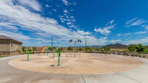 Explore New Homes at Saguaro Bloom by D.R. Horton – A Master-Planned Community in Marana, AZ. Nestled in the foothills of the breathtaking Tucson Mountains, Saguaro Bloom by D.R. Horton is a premier master-planned community in Northwest Marana that offers an exceptional living experience. Saguaro Bloom is divided into distinct neighborhoods, each offering its unique charm and amenities. *Mesquite at Saguaro Bloom* is located in Block 1 and offers a variety of spacious floorplans with 18x18 tile flooring, granite countertops in kitchen and bathrooms, and Shaker-style cabinets in white or gray. These homes feature 9’ ceilings on the first floor, island kitchens, and the Home is Connected® Smart Home package, making them perfect for modern living. *Agave at Saguaro Bloom*, situated in Block 7C, features homes with stunning 6x36” wood-look tile in gray, quartz countertops in kitchen and bathrooms, and Shaker-style cabinets. These homes are designed with stylish interiors and modern conveniences, including LED disc lighting and energy-efficient tankless water heaters. *Cholla Ridge at Saguaro Bloom*, located in Block 7B, offers single-story homes on lots with no rear neighbors. These homes are distinguished by beautiful 12x24” tile flooring, gourmet kitchens, and 10’ ceilings in select homes. With 8’ sliding glass patio doors and super showers, Cholla Ridge combines luxury and privacy in a serene setting. All homes in Saguaro Bloom are built with a Spanish lace stucco exterior, tile roofs, landscaped front yards with auto drip irrigation, and large, fully fenced backyards ready for your design. The homes also include covered front porches and back patios, stainless steel gas appliances, and executive height vanities in all bathrooms. Additionally, as of August 2024, all homes starting production are Zero Energy Ready, meeting rigorous energy efficiency standards that significantly reduce energy costs and environmental impact. Residents of Saguaro Bloom enjoy an array of community amenities, including a clubhouse, two pools with lap lanes and lagoon entry, a fitness center, a splash pad, and over 30 miles of walking trails. The community also features more than 20 pocket parks, playgrounds, and coming soon, a large community park with tennis, pickleball, soccer, baseball, and a dog park. Saguaro Bloom is truly a lifestyle community, offering regular events like Food Truck Thursdays, Movies at the Pool, and holiday decorating contests, all fostering a strong sense of community. Located in the highly-rated Marana Unified School District, Saguaro Bloom is close to excellent schools, including Rattlesnake Ridge Elementary, Marana Middle School, and Marana High School. The community’s location offers a perfect balance of seclusion and convenience, with quick access to I-10, grocery stores, restaurants, and the Twin Peaks Outlet, all within minutes. Downtown Tucson, with its vibrant arts, culture, and entertainment scene, is just a short 15-minute drive away. Surrounded by the natural beauty of the desert landscape, residents can explore nearby outdoor attractions like Saguaro National Park West, the Arizona Desert Museum, and Quarry Pines Golf Course. Whether you enjoy hiking, biking, or simply taking in the stunning views, Saguaro Bloom offers an unparalleled lifestyle in one of Arizona’s most sought-after locations. Discover the perfect blend of modern amenities, scenic beauty, and a strong sense of community at Saguaro Bloom by D.R. Horton – where your new home awaits in Marana, AZ.