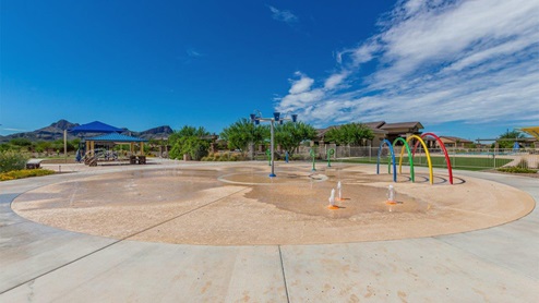 Explore New Homes at Saguaro Bloom by D.R. Horton – A Master-Planned Community in Marana, AZ. Nestled in the foothills of the breathtaking Tucson Mountains, Saguaro Bloom by D.R. Horton is a premier master-planned community in Northwest Marana that offers an exceptional living experience. Saguaro Bloom is divided into distinct neighborhoods, each offering its unique charm and amenities. *Mesquite at Saguaro Bloom* is located in Block 1 and offers a variety of spacious floorplans with 18x18 tile flooring, granite countertops in kitchen and bathrooms, and Shaker-style cabinets in white or gray. These homes feature 9’ ceilings on the first floor, island kitchens, and the Home is Connected® Smart Home package, making them perfect for modern living. *Agave at Saguaro Bloom*, situated in Block 7C, features homes with stunning 6x36” wood-look tile in gray, quartz countertops in kitchen and bathrooms, and Shaker-style cabinets. These homes are designed with stylish interiors and modern conveniences, including LED disc lighting and energy-efficient tankless water heaters. *Cholla Ridge at Saguaro Bloom*, located in Block 7B, offers single-story homes on lots with no rear neighbors. These homes are distinguished by beautiful 12x24” tile flooring, gourmet kitchens, and 10’ ceilings in select homes. With 8’ sliding glass patio doors and super showers, Cholla Ridge combines luxury and privacy in a serene setting. All homes in Saguaro Bloom are built with a Spanish lace stucco exterior, tile roofs, landscaped front yards with auto drip irrigation, and large, fully fenced backyards ready for your design. The homes also include covered front porches and back patios, stainless steel gas appliances, and executive height vanities in all bathrooms. Additionally, as of August 2024, all homes starting production are Zero Energy Ready, meeting rigorous energy efficiency standards that significantly reduce energy costs and environmental impact. Residents of Saguaro Bloom enjoy an array of community amenities, including a clubhouse, two pools with lap lanes and lagoon entry, a fitness center, a splash pad, and over 30 miles of walking trails. The community also features more than 20 pocket parks, playgrounds, and coming soon, a large community park with tennis, pickleball, soccer, baseball, and a dog park. Saguaro Bloom is truly a lifestyle community, offering regular events like Food Truck Thursdays, Movies at the Pool, and holiday decorating contests, all fostering a strong sense of community. Located in the highly-rated Marana Unified School District, Saguaro Bloom is close to excellent schools, including Rattlesnake Ridge Elementary, Marana Middle School, and Marana High School. The community’s location offers a perfect balance of seclusion and convenience, with quick access to I-10, grocery stores, restaurants, and the Twin Peaks Outlet, all within minutes. Downtown Tucson, with its vibrant arts, culture, and entertainment scene, is just a short 15-minute drive away. Surrounded by the natural beauty of the desert landscape, residents can explore nearby outdoor attractions like Saguaro National Park West, the Arizona Desert Museum, and Quarry Pines Golf Course. Whether you enjoy hiking, biking, or simply taking in the stunning views, Saguaro Bloom offers an unparalleled lifestyle in one of Arizona’s most sought-after locations. Discover the perfect blend of modern amenities, scenic beauty, and a strong sense of community at Saguaro Bloom by D.R. Horton – where your new home awaits in Marana, AZ.