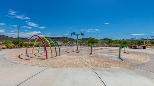 Explore New Homes at Saguaro Bloom by D.R. Horton – A Master-Planned Community in Marana, AZ. Nestled in the foothills of the breathtaking Tucson Mountains, Saguaro Bloom by D.R. Horton is a premier master-planned community in Northwest Marana that offers an exceptional living experience. Saguaro Bloom is divided into distinct neighborhoods, each offering its unique charm and amenities. *Mesquite at Saguaro Bloom* is located in Block 1 and offers a variety of spacious floorplans with 18x18 tile flooring, granite countertops in kitchen and bathrooms, and Shaker-style cabinets in white or gray. These homes feature 9’ ceilings on the first floor, island kitchens, and the Home is Connected® Smart Home package, making them perfect for modern living. *Agave at Saguaro Bloom*, situated in Block 7C, features homes with stunning 6x36” wood-look tile in gray, quartz countertops in kitchen and bathrooms, and Shaker-style cabinets. These homes are designed with stylish interiors and modern conveniences, including LED disc lighting and energy-efficient tankless water heaters. *Cholla Ridge at Saguaro Bloom*, located in Block 7B, offers single-story homes on lots with no rear neighbors. These homes are distinguished by beautiful 12x24” tile flooring, gourmet kitchens, and 10’ ceilings in select homes. With 8’ sliding glass patio doors and super showers, Cholla Ridge combines luxury and privacy in a serene setting. All homes in Saguaro Bloom are built with a Spanish lace stucco exterior, tile roofs, landscaped front yards with auto drip irrigation, and large, fully fenced backyards ready for your design. The homes also include covered front porches and back patios, stainless steel gas appliances, and executive height vanities in all bathrooms. Additionally, as of August 2024, all homes starting production are Zero Energy Ready, meeting rigorous energy efficiency standards that significantly reduce energy costs and environmental impact. Residents of Saguaro Bloom enjoy an array of community amenities, including a clubhouse, two pools with lap lanes and lagoon entry, a fitness center, a splash pad, and over 30 miles of walking trails. The community also features more than 20 pocket parks, playgrounds, and coming soon, a large community park with tennis, pickleball, soccer, baseball, and a dog park. Saguaro Bloom is truly a lifestyle community, offering regular events like Food Truck Thursdays, Movies at the Pool, and holiday decorating contests, all fostering a strong sense of community. Located in the highly-rated Marana Unified School District, Saguaro Bloom is close to excellent schools, including Rattlesnake Ridge Elementary, Marana Middle School, and Marana High School. The community’s location offers a perfect balance of seclusion and convenience, with quick access to I-10, grocery stores, restaurants, and the Twin Peaks Outlet, all within minutes. Downtown Tucson, with its vibrant arts, culture, and entertainment scene, is just a short 15-minute drive away. Surrounded by the natural beauty of the desert landscape, residents can explore nearby outdoor attractions like Saguaro National Park West, the Arizona Desert Museum, and Quarry Pines Golf Course. Whether you enjoy hiking, biking, or simply taking in the stunning views, Saguaro Bloom offers an unparalleled lifestyle in one of Arizona’s most sought-after locations. Discover the perfect blend of modern amenities, scenic beauty, and a strong sense of community at Saguaro Bloom by D.R. Horton – where your new home awaits in Marana, AZ.