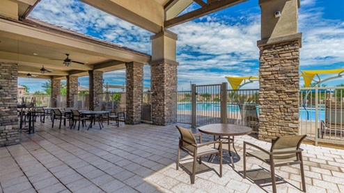 Explore New Homes at Saguaro Bloom by D.R. Horton – A Master-Planned Community in Marana, AZ. Nestled in the foothills of the breathtaking Tucson Mountains, Saguaro Bloom by D.R. Horton is a premier master-planned community in Northwest Marana that offers an exceptional living experience. Saguaro Bloom is divided into distinct neighborhoods, each offering its unique charm and amenities. *Mesquite at Saguaro Bloom* is located in Block 1 and offers a variety of spacious floorplans with 18x18 tile flooring, granite countertops in kitchen and bathrooms, and Shaker-style cabinets in white or gray. These homes feature 9’ ceilings on the first floor, island kitchens, and the Home is Connected® Smart Home package, making them perfect for modern living. *Agave at Saguaro Bloom*, situated in Block 7C, features homes with stunning 6x36” wood-look tile in gray, quartz countertops in kitchen and bathrooms, and Shaker-style cabinets. These homes are designed with stylish interiors and modern conveniences, including LED disc lighting and energy-efficient tankless water heaters. *Cholla Ridge at Saguaro Bloom*, located in Block 7B, offers single-story homes on lots with no rear neighbors. These homes are distinguished by beautiful 12x24” tile flooring, gourmet kitchens, and 10’ ceilings in select homes. With 8’ sliding glass patio doors and super showers, Cholla Ridge combines luxury and privacy in a serene setting. All homes in Saguaro Bloom are built with a Spanish lace stucco exterior, tile roofs, landscaped front yards with auto drip irrigation, and large, fully fenced backyards ready for your design. The homes also include covered front porches and back patios, stainless steel gas appliances, and executive height vanities in all bathrooms. Additionally, as of August 2024, all homes starting production are Zero Energy Ready, meeting rigorous energy efficiency standards that significantly reduce energy costs and environmental impact. Residents of Saguaro Bloom enjoy an array of community amenities, including a clubhouse, two pools with lap lanes and lagoon entry, a fitness center, a splash pad, and over 30 miles of walking trails. The community also features more than 20 pocket parks, playgrounds, and coming soon, a large community park with tennis, pickleball, soccer, baseball, and a dog park. Saguaro Bloom is truly a lifestyle community, offering regular events like Food Truck Thursdays, Movies at the Pool, and holiday decorating contests, all fostering a strong sense of community. Located in the highly-rated Marana Unified School District, Saguaro Bloom is close to excellent schools, including Rattlesnake Ridge Elementary, Marana Middle School, and Marana High School. The community’s location offers a perfect balance of seclusion and convenience, with quick access to I-10, grocery stores, restaurants, and the Twin Peaks Outlet, all within minutes. Downtown Tucson, with its vibrant arts, culture, and entertainment scene, is just a short 15-minute drive away. Surrounded by the natural beauty of the desert landscape, residents can explore nearby outdoor attractions like Saguaro National Park West, the Arizona Desert Museum, and Quarry Pines Golf Course. Whether you enjoy hiking, biking, or simply taking in the stunning views, Saguaro Bloom offers an unparalleled lifestyle in one of Arizona’s most sought-after locations. Discover the perfect blend of modern amenities, scenic beauty, and a strong sense of community at Saguaro Bloom by D.R. Horton – where your new home awaits in Marana, AZ.