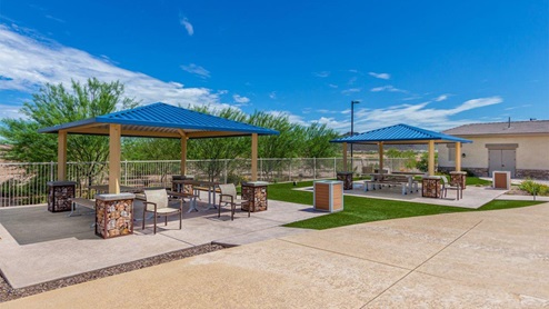Explore New Homes at Saguaro Bloom by D.R. Horton – A Master-Planned Community in Marana, AZ. Nestled in the foothills of the breathtaking Tucson Mountains, Saguaro Bloom by D.R. Horton is a premier master-planned community in Northwest Marana that offers an exceptional living experience. Saguaro Bloom is divided into distinct neighborhoods, each offering its unique charm and amenities. *Mesquite at Saguaro Bloom* is located in Block 1 and offers a variety of spacious floorplans with 18x18 tile flooring, granite countertops in kitchen and bathrooms, and Shaker-style cabinets in white or gray. These homes feature 9’ ceilings on the first floor, island kitchens, and the Home is Connected® Smart Home package, making them perfect for modern living. *Agave at Saguaro Bloom*, situated in Block 7C, features homes with stunning 6x36” wood-look tile in gray, quartz countertops in kitchen and bathrooms, and Shaker-style cabinets. These homes are designed with stylish interiors and modern conveniences, including LED disc lighting and energy-efficient tankless water heaters. *Cholla Ridge at Saguaro Bloom*, located in Block 7B, offers single-story homes on lots with no rear neighbors. These homes are distinguished by beautiful 12x24” tile flooring, gourmet kitchens, and 10’ ceilings in select homes. With 8’ sliding glass patio doors and super showers, Cholla Ridge combines luxury and privacy in a serene setting. All homes in Saguaro Bloom are built with a Spanish lace stucco exterior, tile roofs, landscaped front yards with auto drip irrigation, and large, fully fenced backyards ready for your design. The homes also include covered front porches and back patios, stainless steel gas appliances, and executive height vanities in all bathrooms. Additionally, as of August 2024, all homes starting production are Zero Energy Ready, meeting rigorous energy efficiency standards that significantly reduce energy costs and environmental impact. Residents of Saguaro Bloom enjoy an array of community amenities, including a clubhouse, two pools with lap lanes and lagoon entry, a fitness center, a splash pad, and over 30 miles of walking trails. The community also features more than 20 pocket parks, playgrounds, and coming soon, a large community park with tennis, pickleball, soccer, baseball, and a dog park. Saguaro Bloom is truly a lifestyle community, offering regular events like Food Truck Thursdays, Movies at the Pool, and holiday decorating contests, all fostering a strong sense of community. Located in the highly-rated Marana Unified School District, Saguaro Bloom is close to excellent schools, including Rattlesnake Ridge Elementary, Marana Middle School, and Marana High School. The community’s location offers a perfect balance of seclusion and convenience, with quick access to I-10, grocery stores, restaurants, and the Twin Peaks Outlet, all within minutes. Downtown Tucson, with its vibrant arts, culture, and entertainment scene, is just a short 15-minute drive away. Surrounded by the natural beauty of the desert landscape, residents can explore nearby outdoor attractions like Saguaro National Park West, the Arizona Desert Museum, and Quarry Pines Golf Course. Whether you enjoy hiking, biking, or simply taking in the stunning views, Saguaro Bloom offers an unparalleled lifestyle in one of Arizona’s most sought-after locations. Discover the perfect blend of modern amenities, scenic beauty, and a strong sense of community at Saguaro Bloom by D.R. Horton – where your new home awaits in Marana, AZ.