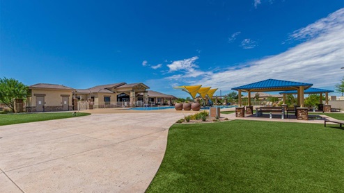 Explore New Homes at Saguaro Bloom by D.R. Horton – A Master-Planned Community in Marana, AZ. Nestled in the foothills of the breathtaking Tucson Mountains, Saguaro Bloom by D.R. Horton is a premier master-planned community in Northwest Marana that offers an exceptional living experience. Saguaro Bloom is divided into distinct neighborhoods, each offering its unique charm and amenities. *Mesquite at Saguaro Bloom* is located in Block 1 and offers a variety of spacious floorplans with 18x18 tile flooring, granite countertops in kitchen and bathrooms, and Shaker-style cabinets in white or gray. These homes feature 9’ ceilings on the first floor, island kitchens, and the Home is Connected® Smart Home package, making them perfect for modern living. *Agave at Saguaro Bloom*, situated in Block 7C, features homes with stunning 6x36” wood-look tile in gray, quartz countertops in kitchen and bathrooms, and Shaker-style cabinets. These homes are designed with stylish interiors and modern conveniences, including LED disc lighting and energy-efficient tankless water heaters. *Cholla Ridge at Saguaro Bloom*, located in Block 7B, offers single-story homes on lots with no rear neighbors. These homes are distinguished by beautiful 12x24” tile flooring, gourmet kitchens, and 10’ ceilings in select homes. With 8’ sliding glass patio doors and super showers, Cholla Ridge combines luxury and privacy in a serene setting. All homes in Saguaro Bloom are built with a Spanish lace stucco exterior, tile roofs, landscaped front yards with auto drip irrigation, and large, fully fenced backyards ready for your design. The homes also include covered front porches and back patios, stainless steel gas appliances, and executive height vanities in all bathrooms. Additionally, as of August 2024, all homes starting production are Zero Energy Ready, meeting rigorous energy efficiency standards that significantly reduce energy costs and environmental impact. Residents of Saguaro Bloom enjoy an array of community amenities, including a clubhouse, two pools with lap lanes and lagoon entry, a fitness center, a splash pad, and over 30 miles of walking trails. The community also features more than 20 pocket parks, playgrounds, and coming soon, a large community park with tennis, pickleball, soccer, baseball, and a dog park. Saguaro Bloom is truly a lifestyle community, offering regular events like Food Truck Thursdays, Movies at the Pool, and holiday decorating contests, all fostering a strong sense of community. Located in the highly-rated Marana Unified School District, Saguaro Bloom is close to excellent schools, including Rattlesnake Ridge Elementary, Marana Middle School, and Marana High School. The community’s location offers a perfect balance of seclusion and convenience, with quick access to I-10, grocery stores, restaurants, and the Twin Peaks Outlet, all within minutes. Downtown Tucson, with its vibrant arts, culture, and entertainment scene, is just a short 15-minute drive away. Surrounded by the natural beauty of the desert landscape, residents can explore nearby outdoor attractions like Saguaro National Park West, the Arizona Desert Museum, and Quarry Pines Golf Course. Whether you enjoy hiking, biking, or simply taking in the stunning views, Saguaro Bloom offers an unparalleled lifestyle in one of Arizona’s most sought-after locations. Discover the perfect blend of modern amenities, scenic beauty, and a strong sense of community at Saguaro Bloom by D.R. Horton – where your new home awaits in Marana, AZ.