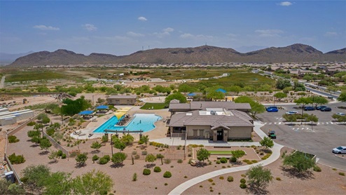 Explore New Homes at Saguaro Bloom by D.R. Horton – A Master-Planned Community in Marana, AZ. Nestled in the foothills of the breathtaking Tucson Mountains, Saguaro Bloom by D.R. Horton is a premier master-planned community in Northwest Marana that offers an exceptional living experience. Saguaro Bloom is divided into distinct neighborhoods, each offering its unique charm and amenities. *Mesquite at Saguaro Bloom* is located in Block 1 and offers a variety of spacious floorplans with 18x18 tile flooring, granite countertops in kitchen and bathrooms, and Shaker-style cabinets in white or gray. These homes feature 9’ ceilings on the first floor, island kitchens, and the Home is Connected® Smart Home package, making them perfect for modern living. *Agave at Saguaro Bloom*, situated in Block 7C, features homes with stunning 6x36” wood-look tile in gray, quartz countertops in kitchen and bathrooms, and Shaker-style cabinets. These homes are designed with stylish interiors and modern conveniences, including LED disc lighting and energy-efficient tankless water heaters. *Cholla Ridge at Saguaro Bloom*, located in Block 7B, offers single-story homes on lots with no rear neighbors. These homes are distinguished by beautiful 12x24” tile flooring, gourmet kitchens, and 10’ ceilings in select homes. With 8’ sliding glass patio doors and super showers, Cholla Ridge combines luxury and privacy in a serene setting. All homes in Saguaro Bloom are built with a Spanish lace stucco exterior, tile roofs, landscaped front yards with auto drip irrigation, and large, fully fenced backyards ready for your design. The homes also include covered front porches and back patios, stainless steel gas appliances, and executive height vanities in all bathrooms. Additionally, as of August 2024, all homes starting production are Zero Energy Ready, meeting rigorous energy efficiency standards that significantly reduce energy costs and environmental impact. Residents of Saguaro Bloom enjoy an array of community amenities, including a clubhouse, two pools with lap lanes and lagoon entry, a fitness center, a splash pad, and over 30 miles of walking trails. The community also features more than 20 pocket parks, playgrounds, and coming soon, a large community park with tennis, pickleball, soccer, baseball, and a dog park. Saguaro Bloom is truly a lifestyle community, offering regular events like Food Truck Thursdays, Movies at the Pool, and holiday decorating contests, all fostering a strong sense of community. Located in the highly-rated Marana Unified School District, Saguaro Bloom is close to excellent schools, including Rattlesnake Ridge Elementary, Marana Middle School, and Marana High School. The community’s location offers a perfect balance of seclusion and convenience, with quick access to I-10, grocery stores, restaurants, and the Twin Peaks Outlet, all within minutes. Downtown Tucson, with its vibrant arts, culture, and entertainment scene, is just a short 15-minute drive away. Surrounded by the natural beauty of the desert landscape, residents can explore nearby outdoor attractions like Saguaro National Park West, the Arizona Desert Museum, and Quarry Pines Golf Course. Whether you enjoy hiking, biking, or simply taking in the stunning views, Saguaro Bloom offers an unparalleled lifestyle in one of Arizona’s most sought-after locations. Discover the perfect blend of modern amenities, scenic beauty, and a strong sense of community at Saguaro Bloom by D.R. Horton – where your new home awaits in Marana, AZ.