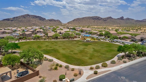 Explore New Homes at Saguaro Bloom by D.R. Horton – A Master-Planned Community in Marana, AZ. Nestled in the foothills of the breathtaking Tucson Mountains, Saguaro Bloom by D.R. Horton is a premier master-planned community in Northwest Marana that offers an exceptional living experience. Saguaro Bloom is divided into distinct neighborhoods, each offering its unique charm and amenities. *Mesquite at Saguaro Bloom* is located in Block 1 and offers a variety of spacious floorplans with 18x18 tile flooring, granite countertops in kitchen and bathrooms, and Shaker-style cabinets in white or gray. These homes feature 9’ ceilings on the first floor, island kitchens, and the Home is Connected® Smart Home package, making them perfect for modern living. *Agave at Saguaro Bloom*, situated in Block 7C, features homes with stunning 6x36” wood-look tile in gray, quartz countertops in kitchen and bathrooms, and Shaker-style cabinets. These homes are designed with stylish interiors and modern conveniences, including LED disc lighting and energy-efficient tankless water heaters. *Cholla Ridge at Saguaro Bloom*, located in Block 7B, offers single-story homes on lots with no rear neighbors. These homes are distinguished by beautiful 12x24” tile flooring, gourmet kitchens, and 10’ ceilings in select homes. With 8’ sliding glass patio doors and super showers, Cholla Ridge combines luxury and privacy in a serene setting. All homes in Saguaro Bloom are built with a Spanish lace stucco exterior, tile roofs, landscaped front yards with auto drip irrigation, and large, fully fenced backyards ready for your design. The homes also include covered front porches and back patios, stainless steel gas appliances, and executive height vanities in all bathrooms. Additionally, as of August 2024, all homes starting production are Zero Energy Ready, meeting rigorous energy efficiency standards that significantly reduce energy costs and environmental impact. Residents of Saguaro Bloom enjoy an array of community amenities, including a clubhouse, two pools with lap lanes and lagoon entry, a fitness center, a splash pad, and over 30 miles of walking trails. The community also features more than 20 pocket parks, playgrounds, and coming soon, a large community park with tennis, pickleball, soccer, baseball, and a dog park. Saguaro Bloom is truly a lifestyle community, offering regular events like Food Truck Thursdays, Movies at the Pool, and holiday decorating contests, all fostering a strong sense of community. Located in the highly-rated Marana Unified School District, Saguaro Bloom is close to excellent schools, including Rattlesnake Ridge Elementary, Marana Middle School, and Marana High School. The community’s location offers a perfect balance of seclusion and convenience, with quick access to I-10, grocery stores, restaurants, and the Twin Peaks Outlet, all within minutes. Downtown Tucson, with its vibrant arts, culture, and entertainment scene, is just a short 15-minute drive away. Surrounded by the natural beauty of the desert landscape, residents can explore nearby outdoor attractions like Saguaro National Park West, the Arizona Desert Museum, and Quarry Pines Golf Course. Whether you enjoy hiking, biking, or simply taking in the stunning views, Saguaro Bloom offers an unparalleled lifestyle in one of Arizona’s most sought-after locations. Discover the perfect blend of modern amenities, scenic beauty, and a strong sense of community at Saguaro Bloom by D.R. Horton – where your new home awaits in Marana, AZ.
