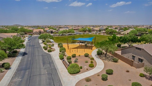 Explore New Homes at Saguaro Bloom by D.R. Horton – A Master-Planned Community in Marana, AZ. Nestled in the foothills of the breathtaking Tucson Mountains, Saguaro Bloom by D.R. Horton is a premier master-planned community in Northwest Marana that offers an exceptional living experience. Saguaro Bloom is divided into distinct neighborhoods, each offering its unique charm and amenities. *Mesquite at Saguaro Bloom* is located in Block 1 and offers a variety of spacious floorplans with 18x18 tile flooring, granite countertops in kitchen and bathrooms, and Shaker-style cabinets in white or gray. These homes feature 9’ ceilings on the first floor, island kitchens, and the Home is Connected® Smart Home package, making them perfect for modern living. *Agave at Saguaro Bloom*, situated in Block 7C, features homes with stunning 6x36” wood-look tile in gray, quartz countertops in kitchen and bathrooms, and Shaker-style cabinets. These homes are designed with stylish interiors and modern conveniences, including LED disc lighting and energy-efficient tankless water heaters. *Cholla Ridge at Saguaro Bloom*, located in Block 7B, offers single-story homes on lots with no rear neighbors. These homes are distinguished by beautiful 12x24” tile flooring, gourmet kitchens, and 10’ ceilings in select homes. With 8’ sliding glass patio doors and super showers, Cholla Ridge combines luxury and privacy in a serene setting. All homes in Saguaro Bloom are built with a Spanish lace stucco exterior, tile roofs, landscaped front yards with auto drip irrigation, and large, fully fenced backyards ready for your design. The homes also include covered front porches and back patios, stainless steel gas appliances, and executive height vanities in all bathrooms. Additionally, as of August 2024, all homes starting production are Zero Energy Ready, meeting rigorous energy efficiency standards that significantly reduce energy costs and environmental impact. Residents of Saguaro Bloom enjoy an array of community amenities, including a clubhouse, two pools with lap lanes and lagoon entry, a fitness center, a splash pad, and over 30 miles of walking trails. The community also features more than 20 pocket parks, playgrounds, and coming soon, a large community park with tennis, pickleball, soccer, baseball, and a dog park. Saguaro Bloom is truly a lifestyle community, offering regular events like Food Truck Thursdays, Movies at the Pool, and holiday decorating contests, all fostering a strong sense of community. Located in the highly-rated Marana Unified School District, Saguaro Bloom is close to excellent schools, including Rattlesnake Ridge Elementary, Marana Middle School, and Marana High School. The community’s location offers a perfect balance of seclusion and convenience, with quick access to I-10, grocery stores, restaurants, and the Twin Peaks Outlet, all within minutes. Downtown Tucson, with its vibrant arts, culture, and entertainment scene, is just a short 15-minute drive away. Surrounded by the natural beauty of the desert landscape, residents can explore nearby outdoor attractions like Saguaro National Park West, the Arizona Desert Museum, and Quarry Pines Golf Course. Whether you enjoy hiking, biking, or simply taking in the stunning views, Saguaro Bloom offers an unparalleled lifestyle in one of Arizona’s most sought-after locations. Discover the perfect blend of modern amenities, scenic beauty, and a strong sense of community at Saguaro Bloom by D.R. Horton – where your new home awaits in Marana, AZ.