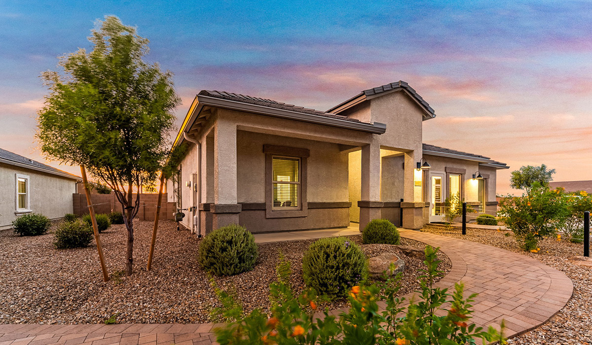 Explore New Homes at Saguaro Bloom by D.R. Horton – A Master-Planned Community in Marana, AZ. Nestled in the foothills of the breathtaking Tucson Mountains, Saguaro Bloom by D.R. Horton is a premier master-planned community in Northwest Marana that offers an exceptional living experience. Saguaro Bloom is divided into distinct neighborhoods, each offering its unique charm and amenities.  *Mesquite at Saguaro Bloom* is located in Block 1 and offers a variety of spacious floorplans with 18x18 tile flooring, granite countertops in kitchen and bathrooms, and Shaker-style cabinets in white or gray. These homes feature 9’ ceilings on the first floor, island kitchens, and the Home is Connected® Smart Home package, making them perfect for modern living.  *Agave at Saguaro Bloom*, situated in Block 7C, features homes with stunning 6x36” wood-look tile in gray, quartz countertops in kitchen and bathrooms, and Shaker-style cabinets. These homes are designed with stylish interiors and modern conveniences, including LED disc lighting and energy-efficient tankless water heaters.  *Cholla Ridge at Saguaro Bloom*, located in Block 7B, offers single-story homes on lots with no rear neighbors. These homes are distinguished by beautiful 12x24” tile flooring, gourmet kitchens, and 10’ ceilings in select homes. With 8’ sliding glass patio doors and super showers, Cholla Ridge combines luxury and privacy in a serene setting.  All homes in Saguaro Bloom are built with a Spanish lace stucco exterior, tile roofs, landscaped front yards with auto drip irrigation, and large, fully fenced backyards ready for your design. The homes also include covered front porches and back patios, stainless steel gas appliances, and executive height vanities in all bathrooms. Additionally, as of August 2024, all homes starting production are Zero Energy Ready, meeting rigorous energy efficiency standards that significantly reduce energy costs and environmental impact.  Residents of Saguaro Bloom enjoy an array of community amenities, including a clubhouse, two pools with lap lanes and lagoon entry, a fitness center, a splash pad, and over 30 miles of walking trails. The community also features more than 20 pocket parks, playgrounds, and coming soon, a large community park with tennis, pickleball, soccer, baseball, and a dog park. Saguaro Bloom is truly a lifestyle community, offering regular events like Food Truck Thursdays, Movies at the Pool, and holiday decorating contests, all fostering a strong sense of community.  Located in the highly-rated Marana Unified School District, Saguaro Bloom is close to excellent schools, including Rattlesnake Ridge Elementary, Marana Middle School, and Marana High School. The community’s location offers a perfect balance of seclusion and convenience, with quick access to I-10, grocery stores, restaurants, and the Twin Peaks Outlet, all within minutes. Downtown Tucson, with its vibrant arts, culture, and entertainment scene, is just a short 15-minute drive away.  Surrounded by the natural beauty of the desert landscape, residents can explore nearby outdoor attractions like Saguaro National Park West, the Arizona Desert Museum, and Quarry Pines Golf Course. Whether you enjoy hiking, biking, or simply taking in the stunning views, Saguaro Bloom offers an unparalleled lifestyle in one of Arizona’s most sought-after locations.  Discover the perfect blend of modern amenities, scenic beauty, and a strong sense of community at Saguaro Bloom by D.R. Horton – where your new home awaits in Marana, AZ.