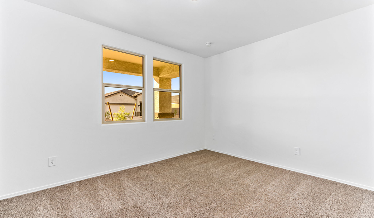 The Dalea is a standout single-story new home floorplan available in the Saguaro Bloom community in Marana, Arizona. Offering 2,224 square feet of living space, this home is designed to accommodate modern living with comfort and style. The Dalea provides a spacious layout with plenty of options such as four to five bedrooms and three full bathrooms, making it an ideal choice for families of all sizes.  As you step into the charming front porch, you are greeted by a spacious and open floor plan that seamlessly connects the main living areas. The great room serves as the central hub of the home, flowing into a dining area and modern kitchen area. The kitchen features a large central island, quartz countertops, Shaker-style cabinetry, walk-in pantry, and ample storage for all your culinary needs.  The primary suite, located at the rear of the home, provides a private retreat with a spacious bedroom, a large walk-in closet, and an en-suite bathroom and a walk-in shower. The Dalea floor plan also includes a utility room and two-car garage with the option of three-car tandem garage.  Living at Saguaro Bloom means more than just having a beautiful home. The community offers a peaceful lifestyle with incredible desert landscapes, mountain views, and easy access to I-10 for convenient commutes to Tucson and surrounding areas. Designed with energy efficiency in mind, The Dalea at Saguaro Bloom meets Zero Energy Ready Home standards, ensuring sustainability and long-term savings.  Step outside to the covered patio, perfect for enjoying the Arizona climate. Whether you're hosting a summer barbecue or simply unwinding in the evening, this outdoor space is a valuable addition to the home.  Residents of Saguaro Bloom enjoy an array of community amenities, including a clubhouse, two pools with lap lanes and lagoon entry, a fitness center, a splash pad, and over 30 miles of walking trails. This vibrant neighborhood is the perfect setting for those looking to enjoy the best of Arizona living.