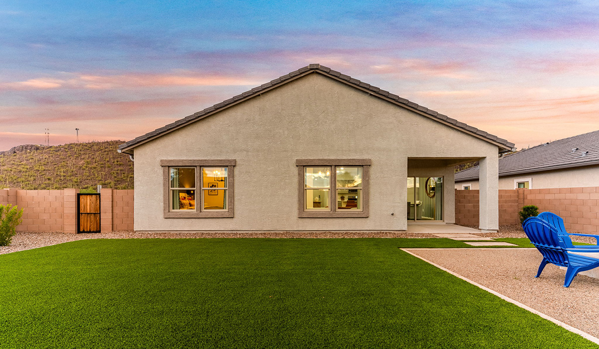 The Cali is a standout single-story new home floorplan available in the Saguaro Bloom community in Marana, Arizona. Offering 1,823 square feet of living space, this home is designed to accommodate modern living with comfort and style. The Cali provides a flexible layout with four bedrooms and two bathrooms, making it an ideal choice for families of all sizes.  The exterior of the Cali presents an inviting façade with its beautiful exterior finishes to suit diverse tastes. As you step inside, you'll be welcomed by a spacious great room that seamlessly connects to the kitchen and dining areas, making it perfect for gatherings and day-to-day living.  This home is equipped with a range of standard features that enhance both its functionality and appeal. Enjoy energy-efficient LED lighting throughout, and a programmable thermostat for easy climate control. The home also includes high-quality finishes such as quartz countertops in the kitchen and bathrooms, and durable wood-look tile flooring in the main living areas.  The kitchen, a focal point of the home, is equipped with stainless steel appliances, ample counter space, and a walk-in pantry that enhances both function and style. The primary bedroom, located at the rear of the home, offers privacy and includes a large walk-in closet and a modern ensuite bathroom with dual vanities and a spacious shower. The remaining three bedrooms are well-sized and share a conveniently located bathroom.  Designed with practicality in mind, this floorplan includes a two-car garage with an option for a third, a utility room with washer and dryer connections, and additional storage space.   Living in Agave at Saguaro Bloom provides residents with access to top-rated schools, community parks, and scenic walking trails. This vibrant neighborhood is the perfect setting for those looking to enjoy the best of Arizona living.  *Images shown are for reference only. They depict the sales model home and may not represent the actual home.