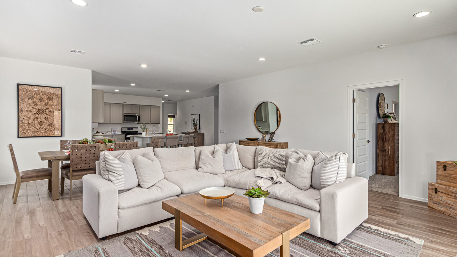 Welcome to the Kingston floor plan in the Agave neighborhood at Saguaro Bloom, Marana, Arizona—a perfect blend of comfort, modern living, and energy efficiency. This thoughtfully crafted one-story home spans 2,051 square feet and offers four bedrooms and two bathrooms, ideal for families of all sizes.  The open-concept design features a spacious great room that effortlessly connects with the kitchen and dining area, creating an inviting central hub for everyday living and entertaining. The kitchen is equipped with contemporary appliances and a pantry.  The primary bedroom, located at the rear of the home, provides a peaceful retreat with a private ensuite bathroom and a walk-in closet. The additional three bedrooms are positioned at the front of the house, offering versatility for use as guest rooms, a home office, or children’s bedrooms. Step outside to the covered patio, a perfect spot to enjoy the beautiful Arizona weather.  Built with energy efficiency as a priority, the Kingston includes smart home technology, which not only simplifies daily living but also helps reduce utility costs. A two-car garage provides ample parking and additional storage space, enhancing the home’s functionality.  Residents of Saguaro Bloom enjoy access to a range of community amenities, including parks, walking trails, and recreational facilities, making this home an ideal choice for those seeking a balanced lifestyle in a scenic setting.