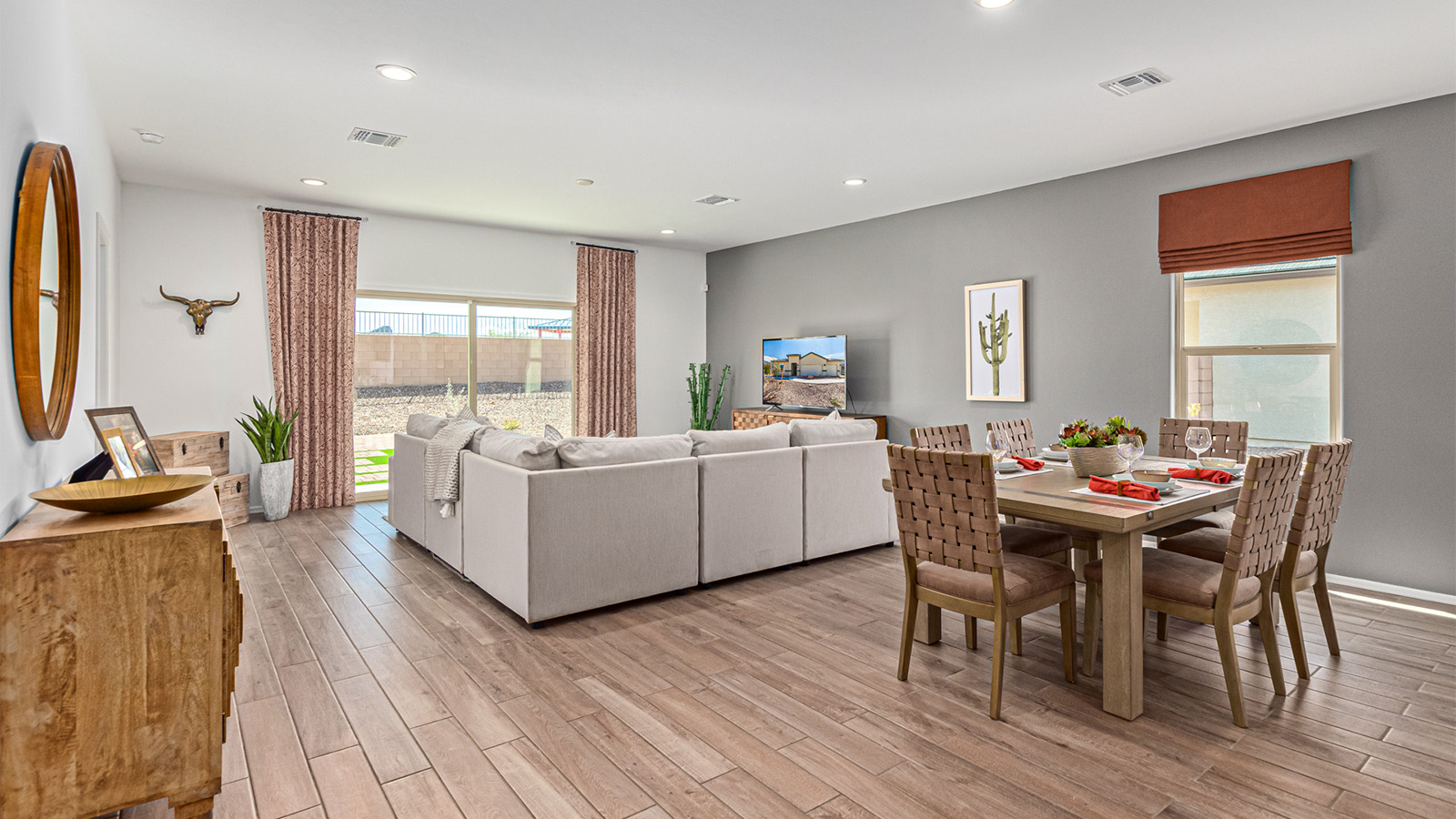 Welcome to the Kingston floor plan in the Agave neighborhood at Saguaro Bloom, Marana, Arizona—a perfect blend of comfort, modern living, and energy efficiency. This thoughtfully crafted one-story home spans 2,051 square feet and offers four bedrooms and two bathrooms, ideal for families of all sizes.  The open-concept design features a spacious great room that effortlessly connects with the kitchen and dining area, creating an inviting central hub for everyday living and entertaining. The kitchen is equipped with contemporary appliances and a pantry.  The primary bedroom, located at the rear of the home, provides a peaceful retreat with a private ensuite bathroom and a walk-in closet. The additional three bedrooms are positioned at the front of the house, offering versatility for use as guest rooms, a home office, or children’s bedrooms. Step outside to the covered patio, a perfect spot to enjoy the beautiful Arizona weather.  Built with energy efficiency as a priority, the Kingston includes smart home technology, which not only simplifies daily living but also helps reduce utility costs. A two-car garage provides ample parking and additional storage space, enhancing the home’s functionality.  Residents of Saguaro Bloom enjoy access to a range of community amenities, including parks, walking trails, and recreational facilities, making this home an ideal choice for those seeking a balanced lifestyle in a scenic setting.