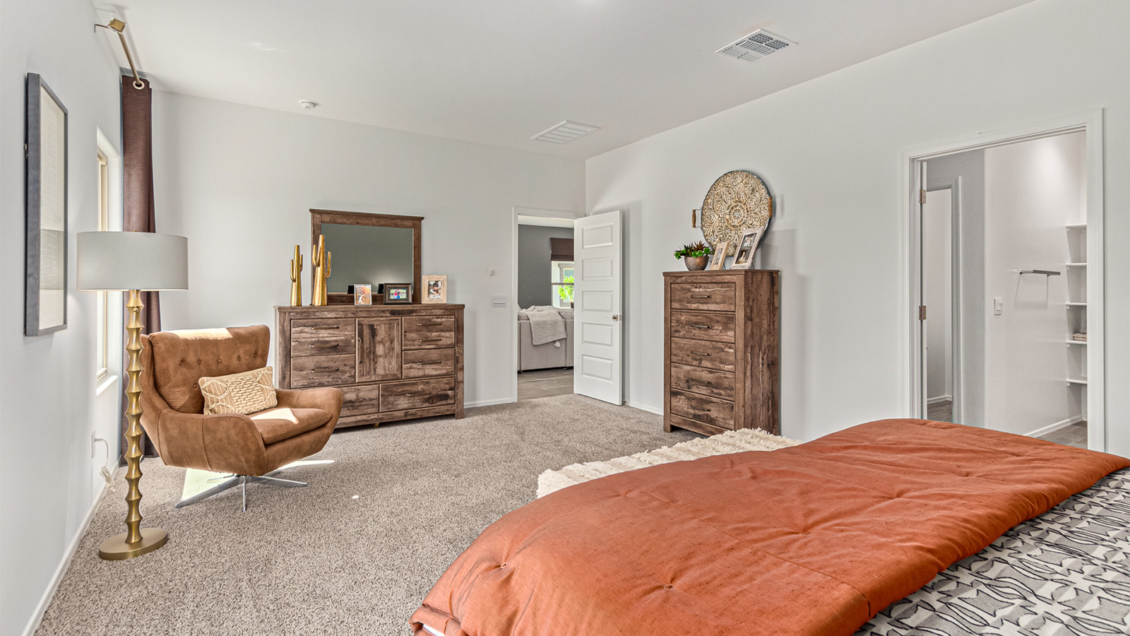 Welcome to the Kingston floor plan in the Agave neighborhood at Saguaro Bloom, Marana, Arizona—a perfect blend of comfort, modern living, and energy efficiency. This thoughtfully crafted one-story home spans 2,051 square feet and offers four bedrooms and two bathrooms, ideal for families of all sizes.  The open-concept design features a spacious great room that effortlessly connects with the kitchen and dining area, creating an inviting central hub for everyday living and entertaining. The kitchen is equipped with contemporary appliances and a pantry.  The primary bedroom, located at the rear of the home, provides a peaceful retreat with a private ensuite bathroom and a walk-in closet. The additional three bedrooms are positioned at the front of the house, offering versatility for use as guest rooms, a home office, or children’s bedrooms. Step outside to the covered patio, a perfect spot to enjoy the beautiful Arizona weather.  Built with energy efficiency as a priority, the Kingston includes smart home technology, which not only simplifies daily living but also helps reduce utility costs. A two-car garage provides ample parking and additional storage space, enhancing the home’s functionality.  Residents of Saguaro Bloom enjoy access to a range of community amenities, including parks, walking trails, and recreational facilities, making this home an ideal choice for those seeking a balanced lifestyle in a scenic setting.