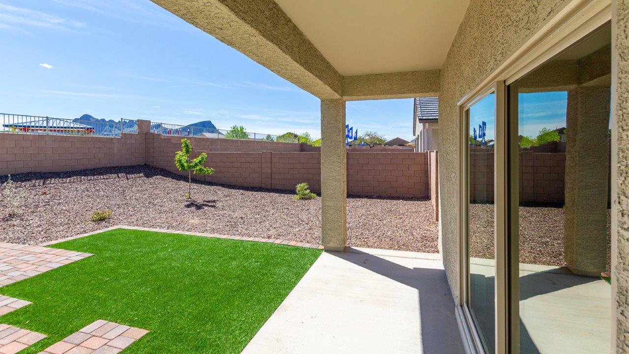 Welcome to the Kingston floor plan in the Agave neighborhood at Saguaro Bloom, Marana, Arizona—a perfect blend of comfort, modern living, and energy efficiency. This thoughtfully crafted one-story home spans 2,051 square feet and offers four bedrooms and two bathrooms, ideal for families of all sizes.  The open-concept design features a spacious great room that effortlessly connects with the kitchen and dining area, creating an inviting central hub for everyday living and entertaining. The kitchen is equipped with contemporary appliances and a pantry.  The primary bedroom, located at the rear of the home, provides a peaceful retreat with a private ensuite bathroom and a walk-in closet. The additional three bedrooms are positioned at the front of the house, offering versatility for use as guest rooms, a home office, or children’s bedrooms. Step outside to the covered patio, a perfect spot to enjoy the beautiful Arizona weather.  Built with energy efficiency as a priority, the Kingston includes smart home technology, which not only simplifies daily living but also helps reduce utility costs. A two-car garage provides ample parking and additional storage space, enhancing the home’s functionality.  Residents of Saguaro Bloom enjoy access to a range of community amenities, including parks, walking trails, and recreational facilities, making this home an ideal choice for those seeking a balanced lifestyle in a scenic setting.