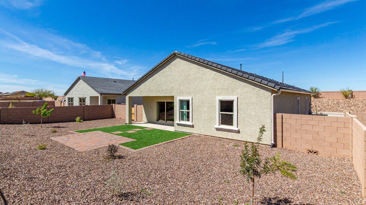 Welcome to the Kingston floor plan in the Agave neighborhood at Saguaro Bloom, Marana, Arizona—a perfect blend of comfort, modern living, and energy efficiency. This thoughtfully crafted one-story home spans 2,051 square feet and offers four bedrooms and two bathrooms, ideal for families of all sizes.  The open-concept design features a spacious great room that effortlessly connects with the kitchen and dining area, creating an inviting central hub for everyday living and entertaining. The kitchen is equipped with contemporary appliances and a pantry.  The primary bedroom, located at the rear of the home, provides a peaceful retreat with a private ensuite bathroom and a walk-in closet. The additional three bedrooms are positioned at the front of the house, offering versatility for use as guest rooms, a home office, or children’s bedrooms. Step outside to the covered patio, a perfect spot to enjoy the beautiful Arizona weather.  Built with energy efficiency as a priority, the Kingston includes smart home technology, which not only simplifies daily living but also helps reduce utility costs. A two-car garage provides ample parking and additional storage space, enhancing the home’s functionality.  Residents of Saguaro Bloom enjoy access to a range of community amenities, including parks, walking trails, and recreational facilities, making this home an ideal choice for those seeking a balanced lifestyle in a scenic setting.