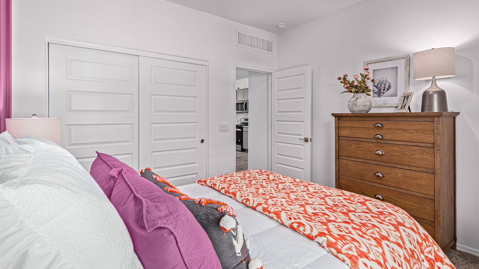 Welcome to the Kingston floor plan in the Agave neighborhood at Saguaro Bloom, Marana, Arizona—a perfect blend of comfort, modern living, and energy efficiency. This thoughtfully crafted one-story home spans 2,051 square feet and offers four bedrooms and two bathrooms, ideal for families of all sizes.  The open-concept design features a spacious great room that effortlessly connects with the kitchen and dining area, creating an inviting central hub for everyday living and entertaining. The kitchen is equipped with contemporary appliances and a pantry.  The primary bedroom, located at the rear of the home, provides a peaceful retreat with a private ensuite bathroom and a walk-in closet. The additional three bedrooms are positioned at the front of the house, offering versatility for use as guest rooms, a home office, or children’s bedrooms. Step outside to the covered patio, a perfect spot to enjoy the beautiful Arizona weather.  Built with energy efficiency as a priority, the Kingston includes smart home technology, which not only simplifies daily living but also helps reduce utility costs. A two-car garage provides ample parking and additional storage space, enhancing the home’s functionality.  Residents of Saguaro Bloom enjoy access to a range of community amenities, including parks, walking trails, and recreational facilities, making this home an ideal choice for those seeking a balanced lifestyle in a scenic setting.