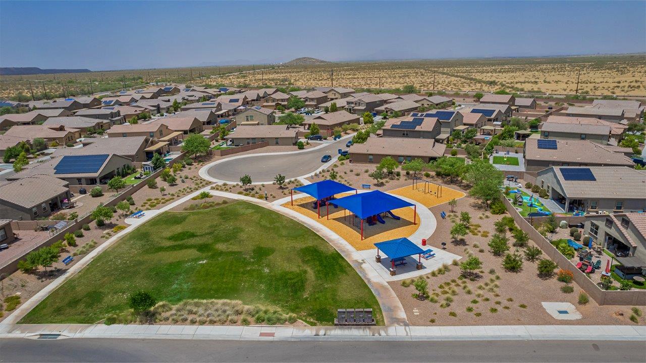 The Rosemont at Agave in Saguaro Bloom, Marana, AZ, is the largest floorplan available in this distinctive neighborhood and the only one of its kind offered throughout Tucson, Marana, Vail, and Sahuarita. This spacious two-story home spans 2,738 square feet and is designed to accommodate modern living with ample room for everyone. Featuring five bedrooms and three bathrooms, this plan offers a perfect balance of private retreats and shared spaces, ensuring comfort and functionality for families of all sizes.  Upon entering, you are welcomed by a generous great room that flows effortlessly into the dining room and kitchen, creating a cohesive space ideal for entertaining or family gatherings. The kitchen is well-equipped with stainless steel appliances, a large island with seating, and a pantry that provides abundant storage. Just off the kitchen, the covered patio offers a seamless transition to outdoor living, perfect for Arizona's mild evenings.  The first floor includes a secondary bedroom and bathroom, providing a private space for guests or an ideal home office. The primary suite, located on the ground floor, features a walk-in closet and an en suite bathroom complete with dual sinks and a spacious shower.  Upstairs, the second floor offers three additional bedrooms, each with ample closet space, and a game room or loft that can be customized to suit your lifestyle—whether it’s a playroom, media center, or home gym. A third bathroom and additional storage space round out the upstairs features, ensuring that everyone has their own space.  Standard features include quartz countertops in the kitchen and bathrooms, wood-look tile flooring in common areas, and shaker-style cabinets. The home is also equipped with the Home is Connected® Smart Home package, which includes keyless entry, a smart thermostat, a video doorbell and more, ensuring convenience and peace of mind.  The Rosemont at Agave is a unique opportunity to enjoy luxury, space, and modern conveniences in one of Marana’s most sought-after communities.