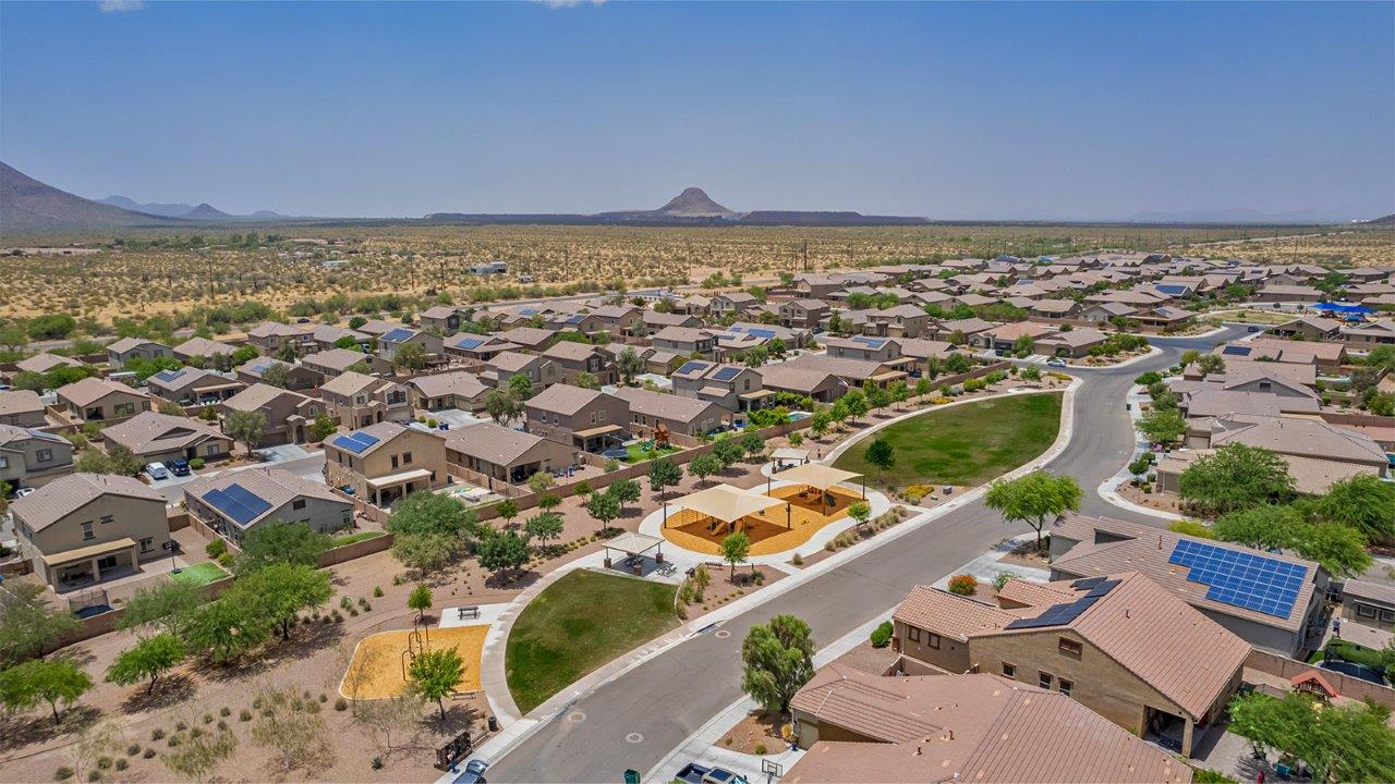 The Rosemont at Agave in Saguaro Bloom, Marana, AZ, is the largest floorplan available in this distinctive neighborhood and the only one of its kind offered throughout Tucson, Marana, Vail, and Sahuarita. This spacious two-story home spans 2,738 square feet and is designed to accommodate modern living with ample room for everyone. Featuring five bedrooms and three bathrooms, this plan offers a perfect balance of private retreats and shared spaces, ensuring comfort and functionality for families of all sizes.  Upon entering, you are welcomed by a generous great room that flows effortlessly into the dining room and kitchen, creating a cohesive space ideal for entertaining or family gatherings. The kitchen is well-equipped with stainless steel appliances, a large island with seating, and a pantry that provides abundant storage. Just off the kitchen, the covered patio offers a seamless transition to outdoor living, perfect for Arizona's mild evenings.  The first floor includes a secondary bedroom and bathroom, providing a private space for guests or an ideal home office. The primary suite, located on the ground floor, features a walk-in closet and an en suite bathroom complete with dual sinks and a spacious shower.  Upstairs, the second floor offers three additional bedrooms, each with ample closet space, and a game room or loft that can be customized to suit your lifestyle—whether it’s a playroom, media center, or home gym. A third bathroom and additional storage space round out the upstairs features, ensuring that everyone has their own space.  Standard features include quartz countertops in the kitchen and bathrooms, wood-look tile flooring in common areas, and shaker-style cabinets. The home is also equipped with the Home is Connected® Smart Home package, which includes keyless entry, a smart thermostat, a video doorbell and more, ensuring convenience and peace of mind.  The Rosemont at Agave is a unique opportunity to enjoy luxury, space, and modern conveniences in one of Marana’s most sought-after communities.