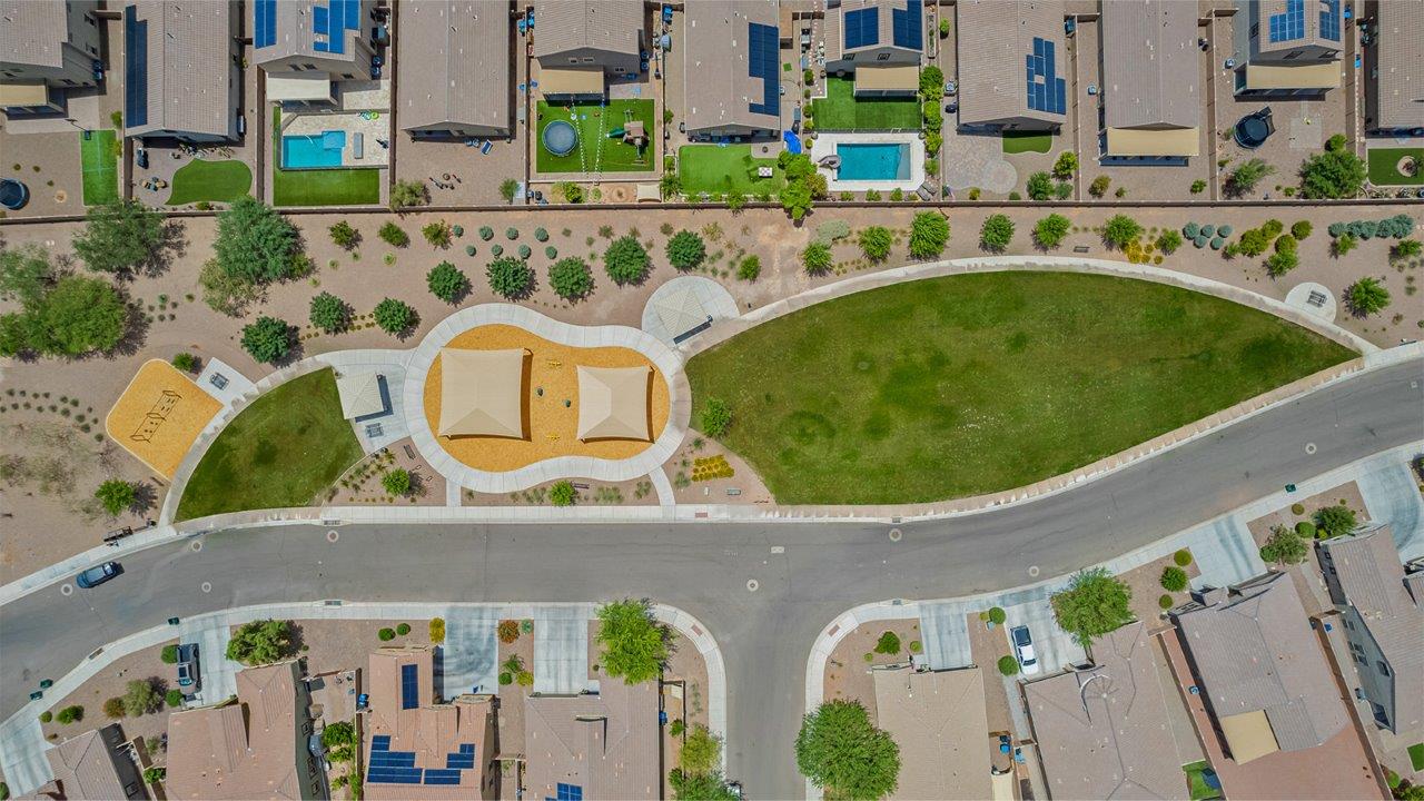 The Rosemont at Agave in Saguaro Bloom, Marana, AZ, is the largest floorplan available in this distinctive neighborhood and the only one of its kind offered throughout Tucson, Marana, Vail, and Sahuarita. This spacious two-story home spans 2,738 square feet and is designed to accommodate modern living with ample room for everyone. Featuring five bedrooms and three bathrooms, this plan offers a perfect balance of private retreats and shared spaces, ensuring comfort and functionality for families of all sizes.  Upon entering, you are welcomed by a generous great room that flows effortlessly into the dining room and kitchen, creating a cohesive space ideal for entertaining or family gatherings. The kitchen is well-equipped with stainless steel appliances, a large island with seating, and a pantry that provides abundant storage. Just off the kitchen, the covered patio offers a seamless transition to outdoor living, perfect for Arizona's mild evenings.  The first floor includes a secondary bedroom and bathroom, providing a private space for guests or an ideal home office. The primary suite, located on the ground floor, features a walk-in closet and an en suite bathroom complete with dual sinks and a spacious shower.  Upstairs, the second floor offers three additional bedrooms, each with ample closet space, and a game room or loft that can be customized to suit your lifestyle—whether it’s a playroom, media center, or home gym. A third bathroom and additional storage space round out the upstairs features, ensuring that everyone has their own space.  Standard features include quartz countertops in the kitchen and bathrooms, wood-look tile flooring in common areas, and shaker-style cabinets. The home is also equipped with the Home is Connected® Smart Home package, which includes keyless entry, a smart thermostat, a video doorbell and more, ensuring convenience and peace of mind.  The Rosemont at Agave is a unique opportunity to enjoy luxury, space, and modern conveniences in one of Marana’s most sought-after communities.