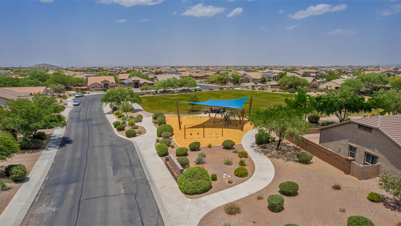 The Rosemont at Agave in Saguaro Bloom, Marana, AZ, is the largest floorplan available in this distinctive neighborhood and the only one of its kind offered throughout Tucson, Marana, Vail, and Sahuarita. This spacious two-story home spans 2,738 square feet and is designed to accommodate modern living with ample room for everyone. Featuring five bedrooms and three bathrooms, this plan offers a perfect balance of private retreats and shared spaces, ensuring comfort and functionality for families of all sizes.  Upon entering, you are welcomed by a generous great room that flows effortlessly into the dining room and kitchen, creating a cohesive space ideal for entertaining or family gatherings. The kitchen is well-equipped with stainless steel appliances, a large island with seating, and a pantry that provides abundant storage. Just off the kitchen, the covered patio offers a seamless transition to outdoor living, perfect for Arizona's mild evenings.  The first floor includes a secondary bedroom and bathroom, providing a private space for guests or an ideal home office. The primary suite, located on the ground floor, features a walk-in closet and an en suite bathroom complete with dual sinks and a spacious shower.  Upstairs, the second floor offers three additional bedrooms, each with ample closet space, and a game room or loft that can be customized to suit your lifestyle—whether it’s a playroom, media center, or home gym. A third bathroom and additional storage space round out the upstairs features, ensuring that everyone has their own space.  Standard features include quartz countertops in the kitchen and bathrooms, wood-look tile flooring in common areas, and shaker-style cabinets. The home is also equipped with the Home is Connected® Smart Home package, which includes keyless entry, a smart thermostat, a video doorbell and more, ensuring convenience and peace of mind.  The Rosemont at Agave is a unique opportunity to enjoy luxury, space, and modern conveniences in one of Marana’s most sought-after communities.