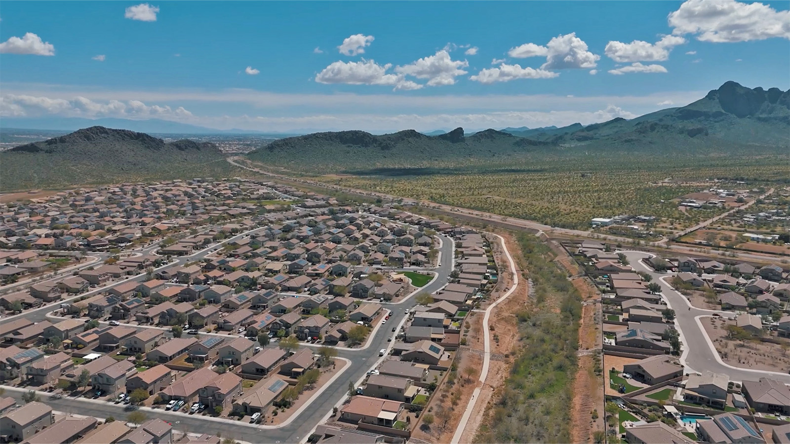 The Rosemont at Agave in Saguaro Bloom, Marana, AZ, is the largest floorplan available in this distinctive neighborhood and the only one of its kind offered throughout Tucson, Marana, Vail, and Sahuarita. This spacious two-story home spans 2,738 square feet and is designed to accommodate modern living with ample room for everyone. Featuring five bedrooms and three bathrooms, this plan offers a perfect balance of private retreats and shared spaces, ensuring comfort and functionality for families of all sizes.  Upon entering, you are welcomed by a generous great room that flows effortlessly into the dining room and kitchen, creating a cohesive space ideal for entertaining or family gatherings. The kitchen is well-equipped with stainless steel appliances, a large island with seating, and a pantry that provides abundant storage. Just off the kitchen, the covered patio offers a seamless transition to outdoor living, perfect for Arizona's mild evenings.  The first floor includes a secondary bedroom and bathroom, providing a private space for guests or an ideal home office. The primary suite, located on the ground floor, features a walk-in closet and an en suite bathroom complete with dual sinks and a spacious shower.  Upstairs, the second floor offers three additional bedrooms, each with ample closet space, and a game room or loft that can be customized to suit your lifestyle—whether it’s a playroom, media center, or home gym. A third bathroom and additional storage space round out the upstairs features, ensuring that everyone has their own space.  Standard features include quartz countertops in the kitchen and bathrooms, wood-look tile flooring in common areas, and shaker-style cabinets. The home is also equipped with the Home is Connected® Smart Home package, which includes keyless entry, a smart thermostat, a video doorbell and more, ensuring convenience and peace of mind.  The Rosemont at Agave is a unique opportunity to enjoy luxury, space, and modern conveniences in one of Marana’s most sought-after communities.