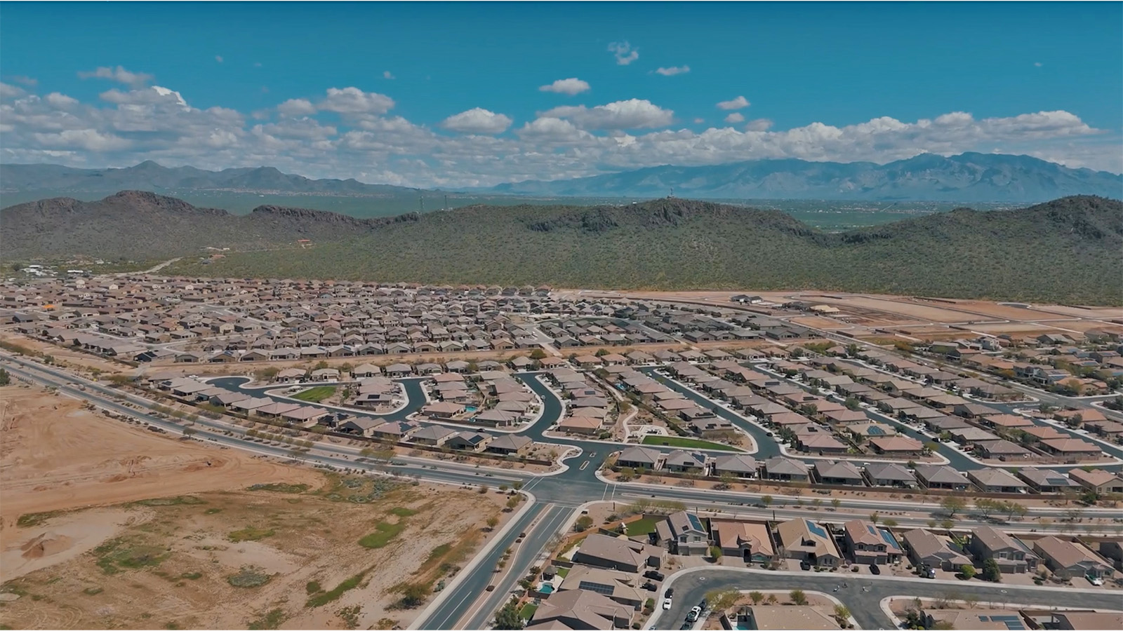 The Rosemont at Agave in Saguaro Bloom, Marana, AZ, is the largest floorplan available in this distinctive neighborhood and the only one of its kind offered throughout Tucson, Marana, Vail, and Sahuarita. This spacious two-story home spans 2,738 square feet and is designed to accommodate modern living with ample room for everyone. Featuring five bedrooms and three bathrooms, this plan offers a perfect balance of private retreats and shared spaces, ensuring comfort and functionality for families of all sizes.  Upon entering, you are welcomed by a generous great room that flows effortlessly into the dining room and kitchen, creating a cohesive space ideal for entertaining or family gatherings. The kitchen is well-equipped with stainless steel appliances, a large island with seating, and a pantry that provides abundant storage. Just off the kitchen, the covered patio offers a seamless transition to outdoor living, perfect for Arizona's mild evenings.  The first floor includes a secondary bedroom and bathroom, providing a private space for guests or an ideal home office. The primary suite, located on the ground floor, features a walk-in closet and an en suite bathroom complete with dual sinks and a spacious shower.  Upstairs, the second floor offers three additional bedrooms, each with ample closet space, and a game room or loft that can be customized to suit your lifestyle—whether it’s a playroom, media center, or home gym. A third bathroom and additional storage space round out the upstairs features, ensuring that everyone has their own space.  Standard features include quartz countertops in the kitchen and bathrooms, wood-look tile flooring in common areas, and shaker-style cabinets. The home is also equipped with the Home is Connected® Smart Home package, which includes keyless entry, a smart thermostat, a video doorbell and more, ensuring convenience and peace of mind.  The Rosemont at Agave is a unique opportunity to enjoy luxury, space, and modern conveniences in one of Marana’s most sought-after communities.