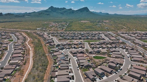 Explore New Homes at Saguaro Bloom by D.R. Horton – A Master-Planned Community in Marana, AZ. Nestled in the foothills of the breathtaking Tucson Mountains, Saguaro Bloom by D.R. Horton is a premier master-planned community in Northwest Marana that offers an exceptional living experience. Saguaro Bloom is divided into distinct neighborhoods, each offering its unique charm and amenities. *Mesquite at Saguaro Bloom* is located in Block 1 and offers a variety of spacious floorplans with 18x18 tile flooring, granite countertops in kitchen and bathrooms, and Shaker-style cabinets in white or gray. These homes feature 9’ ceilings on the first floor, island kitchens, and the Home is Connected® Smart Home package, making them perfect for modern living. *Agave at Saguaro Bloom*, situated in Block 7C, features homes with stunning 6x36” wood-look tile in gray, quartz countertops in kitchen and bathrooms, and Shaker-style cabinets. These homes are designed with stylish interiors and modern conveniences, including LED disc lighting and energy-efficient tankless water heaters. *Cholla Ridge at Saguaro Bloom*, located in Block 7B, offers single-story homes on lots with no rear neighbors. These homes are distinguished by beautiful 12x24” tile flooring, gourmet kitchens, and 10’ ceilings in select homes. With 8’ sliding glass patio doors and super showers, Cholla Ridge combines luxury and privacy in a serene setting. All homes in Saguaro Bloom are built with a Spanish lace stucco exterior, tile roofs, landscaped front yards with auto drip irrigation, and large, fully fenced backyards ready for your design. The homes also include covered front porches and back patios, stainless steel gas appliances, and executive height vanities in all bathrooms. Additionally, as of August 2024, all homes starting production are Zero Energy Ready, meeting rigorous energy efficiency standards that significantly reduce energy costs and environmental impact. Residents of Saguaro Bloom enjoy an array of community amenities, including a clubhouse, two pools with lap lanes and lagoon entry, a fitness center, a splash pad, and over 30 miles of walking trails. The community also features more than 20 pocket parks, playgrounds, and coming soon, a large community park with tennis, pickleball, soccer, baseball, and a dog park. Saguaro Bloom is truly a lifestyle community, offering regular events like Food Truck Thursdays, Movies at the Pool, and holiday decorating contests, all fostering a strong sense of community. Located in the highly-rated Marana Unified School District, Saguaro Bloom is close to excellent schools, including Rattlesnake Ridge Elementary, Marana Middle School, and Marana High School. The community’s location offers a perfect balance of seclusion and convenience, with quick access to I-10, grocery stores, restaurants, and the Twin Peaks Outlet, all within minutes. Downtown Tucson, with its vibrant arts, culture, and entertainment scene, is just a short 15-minute drive away. Surrounded by the natural beauty of the desert landscape, residents can explore nearby outdoor attractions like Saguaro National Park West, the Arizona Desert Museum, and Quarry Pines Golf Course. Whether you enjoy hiking, biking, or simply taking in the stunning views, Saguaro Bloom offers an unparalleled lifestyle in one of Arizona’s most sought-after locations. Discover the perfect blend of modern amenities, scenic beauty, and a strong sense of community at Saguaro Bloom by D.R. Horton – where your new home awaits in Marana, AZ.