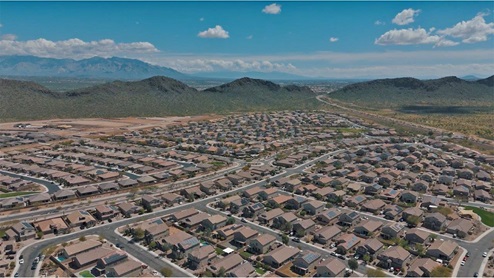 Explore New Homes at Saguaro Bloom by D.R. Horton – A Master-Planned Community in Marana, AZ. Nestled in the foothills of the breathtaking Tucson Mountains, Saguaro Bloom by D.R. Horton is a premier master-planned community in Northwest Marana that offers an exceptional living experience. Saguaro Bloom is divided into distinct neighborhoods, each offering its unique charm and amenities. *Mesquite at Saguaro Bloom* is located in Block 1 and offers a variety of spacious floorplans with 18x18 tile flooring, granite countertops in kitchen and bathrooms, and Shaker-style cabinets in white or gray. These homes feature 9’ ceilings on the first floor, island kitchens, and the Home is Connected® Smart Home package, making them perfect for modern living. *Agave at Saguaro Bloom*, situated in Block 7C, features homes with stunning 6x36” wood-look tile in gray, quartz countertops in kitchen and bathrooms, and Shaker-style cabinets. These homes are designed with stylish interiors and modern conveniences, including LED disc lighting and energy-efficient tankless water heaters. *Cholla Ridge at Saguaro Bloom*, located in Block 7B, offers single-story homes on lots with no rear neighbors. These homes are distinguished by beautiful 12x24” tile flooring, gourmet kitchens, and 10’ ceilings in select homes. With 8’ sliding glass patio doors and super showers, Cholla Ridge combines luxury and privacy in a serene setting. All homes in Saguaro Bloom are built with a Spanish lace stucco exterior, tile roofs, landscaped front yards with auto drip irrigation, and large, fully fenced backyards ready for your design. The homes also include covered front porches and back patios, stainless steel gas appliances, and executive height vanities in all bathrooms. Additionally, as of August 2024, all homes starting production are Zero Energy Ready, meeting rigorous energy efficiency standards that significantly reduce energy costs and environmental impact. Residents of Saguaro Bloom enjoy an array of community amenities, including a clubhouse, two pools with lap lanes and lagoon entry, a fitness center, a splash pad, and over 30 miles of walking trails. The community also features more than 20 pocket parks, playgrounds, and coming soon, a large community park with tennis, pickleball, soccer, baseball, and a dog park. Saguaro Bloom is truly a lifestyle community, offering regular events like Food Truck Thursdays, Movies at the Pool, and holiday decorating contests, all fostering a strong sense of community. Located in the highly-rated Marana Unified School District, Saguaro Bloom is close to excellent schools, including Rattlesnake Ridge Elementary, Marana Middle School, and Marana High School. The community’s location offers a perfect balance of seclusion and convenience, with quick access to I-10, grocery stores, restaurants, and the Twin Peaks Outlet, all within minutes. Downtown Tucson, with its vibrant arts, culture, and entertainment scene, is just a short 15-minute drive away. Surrounded by the natural beauty of the desert landscape, residents can explore nearby outdoor attractions like Saguaro National Park West, the Arizona Desert Museum, and Quarry Pines Golf Course. Whether you enjoy hiking, biking, or simply taking in the stunning views, Saguaro Bloom offers an unparalleled lifestyle in one of Arizona’s most sought-after locations. Discover the perfect blend of modern amenities, scenic beauty, and a strong sense of community at Saguaro Bloom by D.R. Horton – where your new home awaits in Marana, AZ.