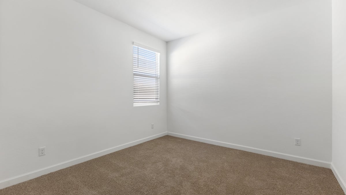 The Garland is a spacious single-story new home situated in the Agave neighborhood at Saguaro Bloom, offering 2,273 square feet of well-planned living. This home features four bedrooms and three full bathrooms making it an ideal choice for families and those needing room to grow.  As you enter through the porch and into the front door, you're greeted by the open concept layout with a seamless flow between the living, dining, and kitchen area. The kitchen features a large central island, quartz countertops, and your choice of flat panel Shaker-style cabinet doors with multiple color options available. A walk-in pantry provides additional storage, making it easy to keep everything organized.  The Garland's four bedrooms are thoughtfully arranged to provide both privacy and convenience. The primary suite is tucked away at the rear of the home, offering a private retreat with walk-in closets off the en-suite bathroom complete with an optional dual sink vanity. The additional bedrooms are strategically placed near the front and center of the home, each with access to a full bathroom, ensuring comfort for all family members or guests.  The large great room serves as the central gathering space, perfect for family activities or entertaining guests. Adjacent to the great room is a covered patio, extending your living space outdoors and offering a perfect spot to enjoy the serene surroundings of Saguaro Bloom.  Practical features like a dedicated utility room and a spacious three-car garage enhance the functionality of this home, while large windows ensure that natural light fills the space, creating a bright and inviting atmosphere.  Located within the vibrant Saguaro Bloom community, residents of The Garland can take advantage of a wide array of amenities, from resort-style pools to extensive walking trails. This home offers a unique opportunity to enjoy both comfort and community in one of Marana’s most sought-after neighborhoods.  *Images shown are for reference only. They depict a Garland home and may not represent the actual home or design package.