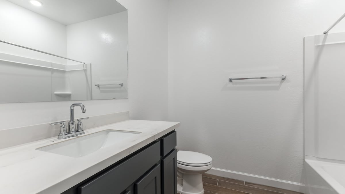 The Garland is a spacious single-story new home situated in the Agave neighborhood at Saguaro Bloom, offering 2,273 square feet of well-planned living. This home features four bedrooms and three full bathrooms making it an ideal choice for families and those needing room to grow.  As you enter through the porch and into the front door, you're greeted by the open concept layout with a seamless flow between the living, dining, and kitchen area. The kitchen features a large central island, quartz countertops, and your choice of flat panel Shaker-style cabinet doors with multiple color options available. A walk-in pantry provides additional storage, making it easy to keep everything organized.  The Garland's four bedrooms are thoughtfully arranged to provide both privacy and convenience. The primary suite is tucked away at the rear of the home, offering a private retreat with walk-in closets off the en-suite bathroom complete with an optional dual sink vanity. The additional bedrooms are strategically placed near the front and center of the home, each with access to a full bathroom, ensuring comfort for all family members or guests.  The large great room serves as the central gathering space, perfect for family activities or entertaining guests. Adjacent to the great room is a covered patio, extending your living space outdoors and offering a perfect spot to enjoy the serene surroundings of Saguaro Bloom.  Practical features like a dedicated utility room and a spacious three-car garage enhance the functionality of this home, while large windows ensure that natural light fills the space, creating a bright and inviting atmosphere.  Located within the vibrant Saguaro Bloom community, residents of The Garland can take advantage of a wide array of amenities, from resort-style pools to extensive walking trails. This home offers a unique opportunity to enjoy both comfort and community in one of Marana’s most sought-after neighborhoods.  *Images shown are for reference only. They depict a Garland home and may not represent the actual home or design package.