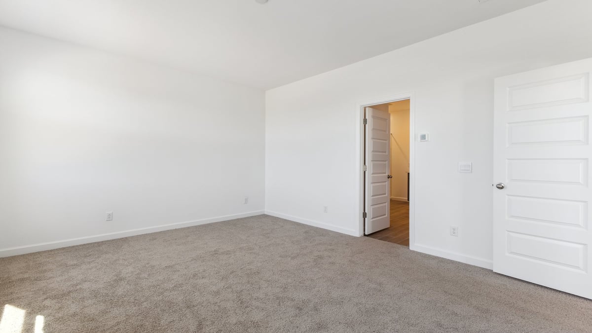 The Garland floor plan is a spacious single-story new home situated in the Agave neighborhood at Saguaro Bloom, offering 2,273 square feet of well-planned living space that perfectly suits a variety of lifestyles. This home features four bedrooms and three full bathrooms making it an ideal choice for families and those needing room to grow. As you step into the front porch and through the front door, you're greeted by the open concept layout with a seamless flow between the living, dining, and kitchen area, ensuring that every part of the home feels connected. The kitchen, equipped with a central island, quartz countertops, and your choice of flat panel Shaker-style cabinet doors with multiple color options available. A walk-in pantry provides additional storage, making it easy to keep everything organized.  The Garland's four bedrooms are thoughtfully arranged to provide both privacy and convenience. The primary suite is tucked away at the rear of the home, offering a private retreat with walk-in closets off the en-suite bathroom complete with an optional dual sink vanity. The additional bedrooms are strategically placed near the front and center of the home, each with access to a full bathroom, ensuring comfort for all family members or guests.  The large great room serves as the central gathering space, perfect for family activities or entertaining guests. Adjacent to the great room is a covered patio, extending your living space outdoors and offering a perfect spot to enjoy the serene surroundings of Saguaro Bloom.  Practical features like a dedicated utility room and a spacious three-car garage enhance the functionality of this home, while large windows ensure that natural light fills the space, creating a bright and inviting atmosphere.  Located within the vibrant Saguaro Bloom community, residents of The Garland can take advantage of a wide array of amenities, from resort-style pools to extensive walking trails. This home offers a unique opportunity to enjoy both comfort and community in one of Marana’s most sought-after neighborhoods.